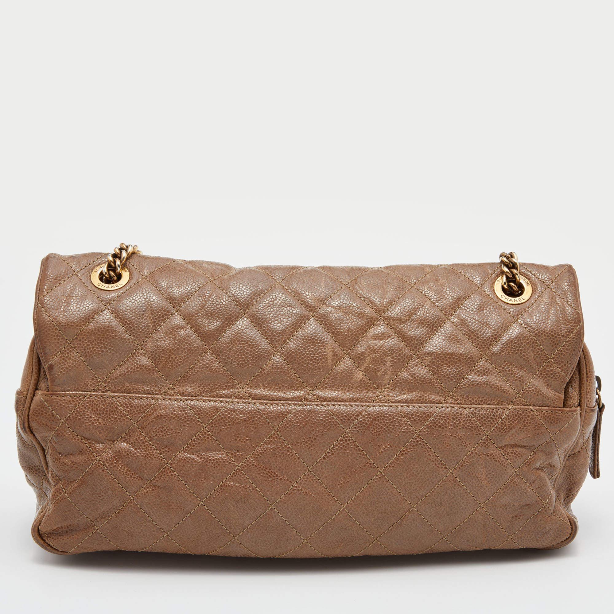 The house of Chanel offers this beautiful Maxi Shiva Flap bag to help you create timeless style edits every season. Crafted using brown leather and added with iconic details, this piece will put a touch of luxury to any edit.

