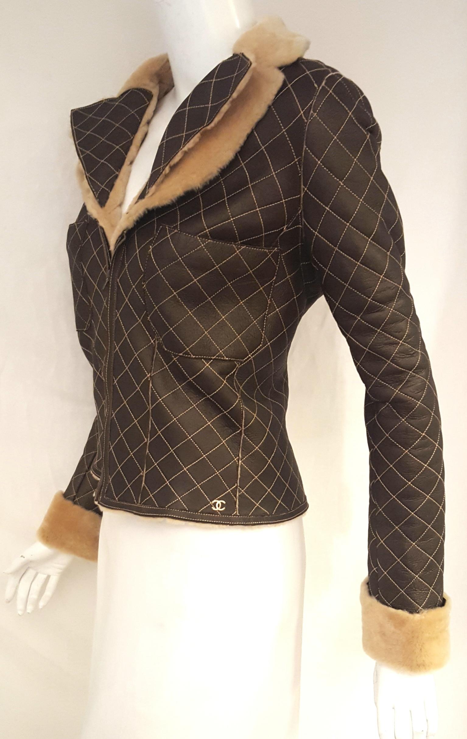 Chanel slightly iridescent brown quilted lambskin shearling crop jacket from the fall 2004 collection features a notch collar and turn up cuffs.  This jacket has the signature Chanel diamond design on both the exterior and interior, the same design