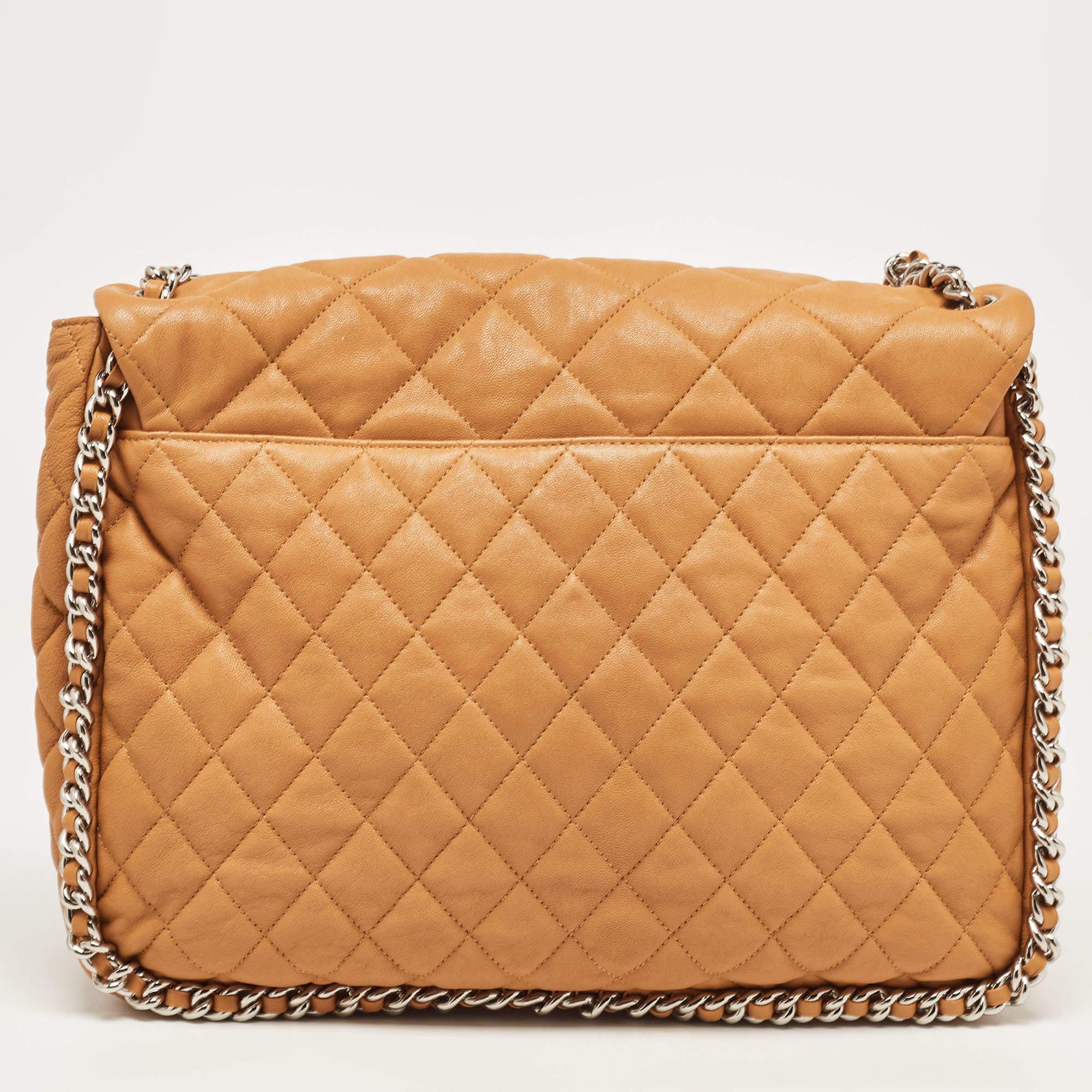 This Chanel bag is perfect for your fashion arsenal, bringing along the iconic quilt pattern, the CC logo on the flap, and woven chains outlining the bag and ending as a shoulder strap. It is finely crafted from leather and equipped with a spacious