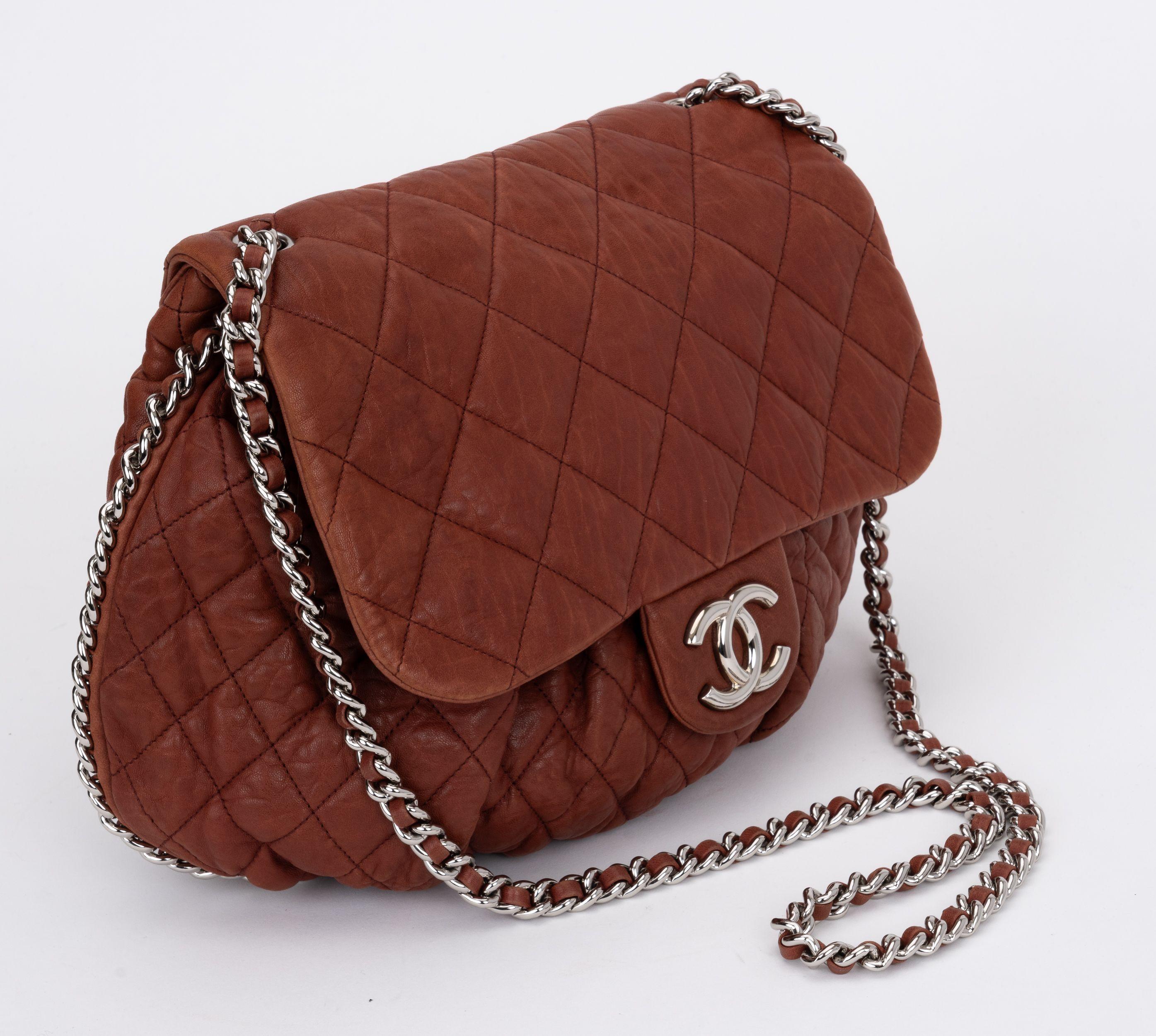 Chanel chain around medium shoulder/cross body bag. Medium brown quilted leather and silver tone chain. Shoulder drop 23
