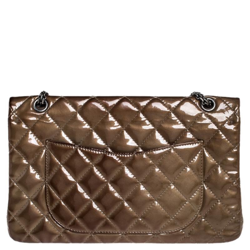 Chanel's Flap bags are iconic and noteworthy in the history of fashion. Hence, this Reissue 2.55 is a buy that is worth every bit of your splurge. Exquisitely crafted from brown patent leather, it bears their signature quilt pattern and the iconic
