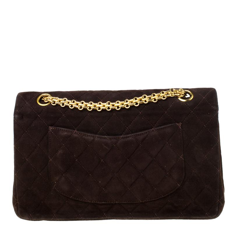 Chanel's Flap Bags are iconic and noteworthy in the history of fashion. Hence, this Reissue 2.55 Classic 225 is a buy that is worth every bit of your splurge. Exquisitely crafted from suede, it bears their signature quilt pattern and the iconic