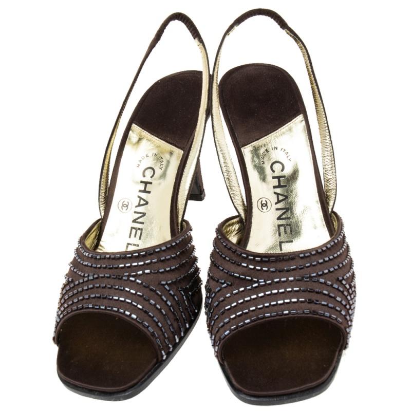 There will always be room in a woman's shoe closet for a pair of Chanel shoes. We have here a gorgeous pair in brown satin. The sandals feature embellished uppers, slingback closure, and 8 cm heels.

Includes: Original Box, Original Dustbag
