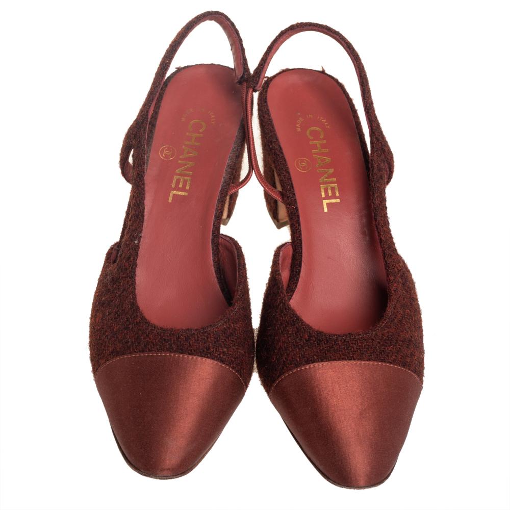 Simply luxe, these sandals from Chanel will help you stay comfortable throughout the day! The brown sandals are crafted from tweed and satin and designed with almond toes and slingbacks. They come equipped with comfortable leather-lined insoles and