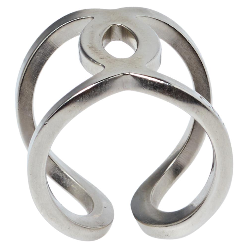 Simple, minimal yet classic, this Chanel ring has an open-work design and makes for a great addition to your accessory collection. It is crafted in silver-tone metal and finished with smooth lines and curves.

Includes: Original Box