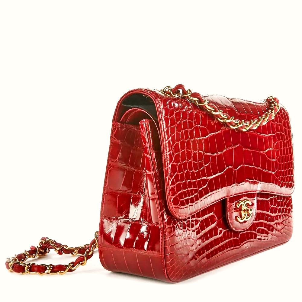 Rare Burgundy CHANEL Alligator Jumbo Double Flap Bag is a must for any collector of exotic handbags in general and Chanel bags in particular! Features burgundy shiny alligator leather with gold-tone hardware, CC turn-lock closure, convertible