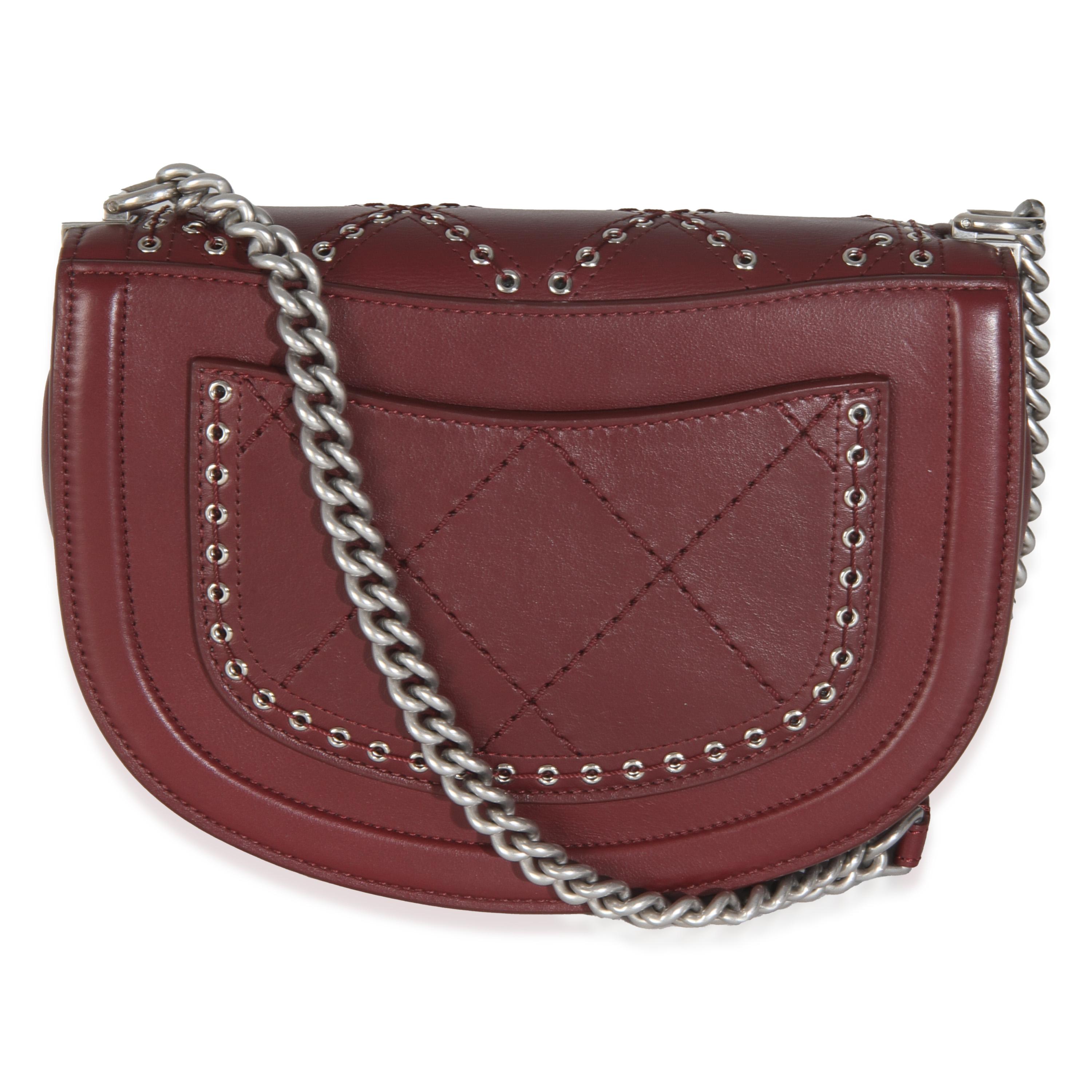 Listing Title: Chanel Burgundy Calfskin Small Coco Eyelets Flap Bag
SKU: 145784
Condition: Pre-owned 
Condition Description: A timeless classic that never goes out of style, the flap bag from Chanel dates back to 1955 and has seen a number of