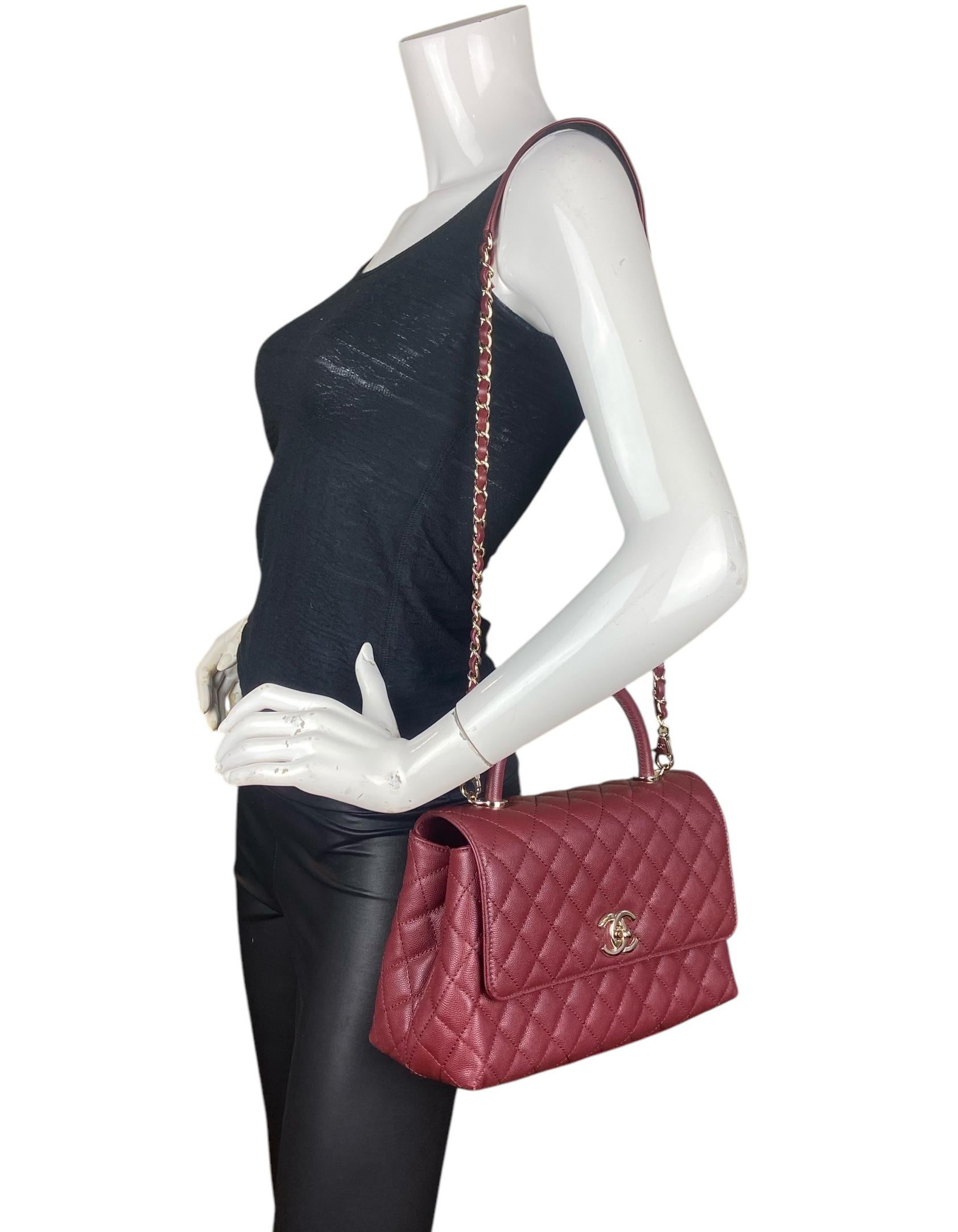 Chanel Burgundy Caviar Leather Quilted Small Coco Handle Flap Bag

Made In: Italy
Year of Production: 2024
Color: Burgundy
Hardware: Pale goldtone
Materials: Caviar leather
Lining: Leather
Closure/Opening: Flap top with CC twist lock
Exterior