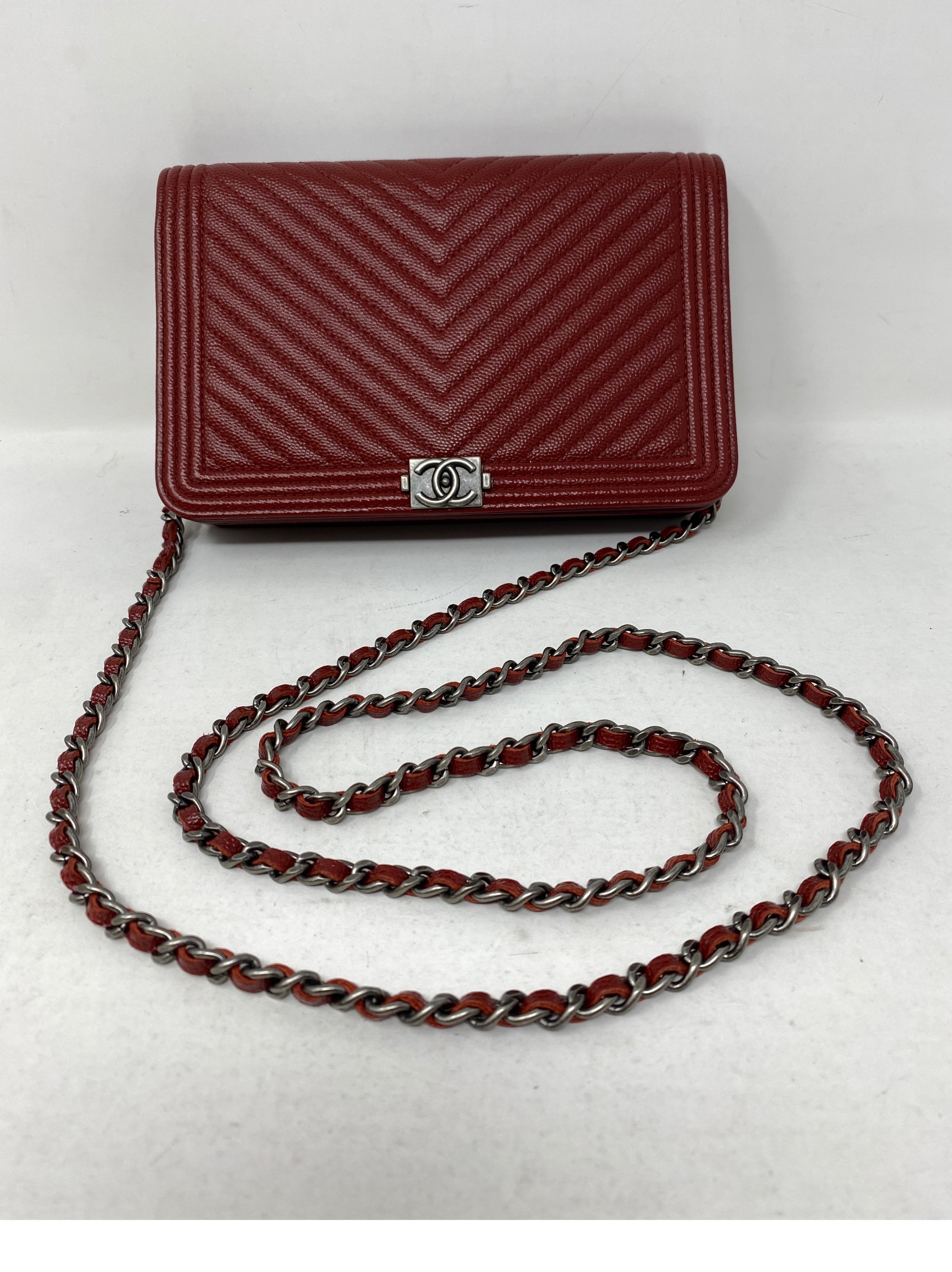 Chanel Burgundy Red Chevron Wallet On A Chain Bag. Crossbody or clutch bag. Excellent condition. Includes authenticity card. Ruthenium hardware. Guaranteed authentic. 
