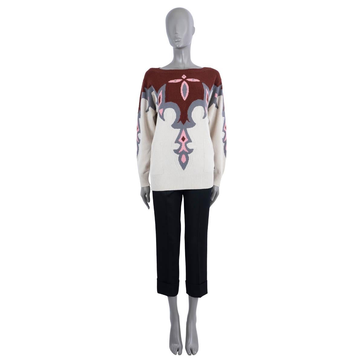 100% authentic Chanel intarsia sweater in burgundy, ivory, pink and grey cashmere (100%). Features a round neck, two pockets on the front and a star-button at the waist. Has been worn and is in excellent condition.

2014 Paris-Dallas Metier