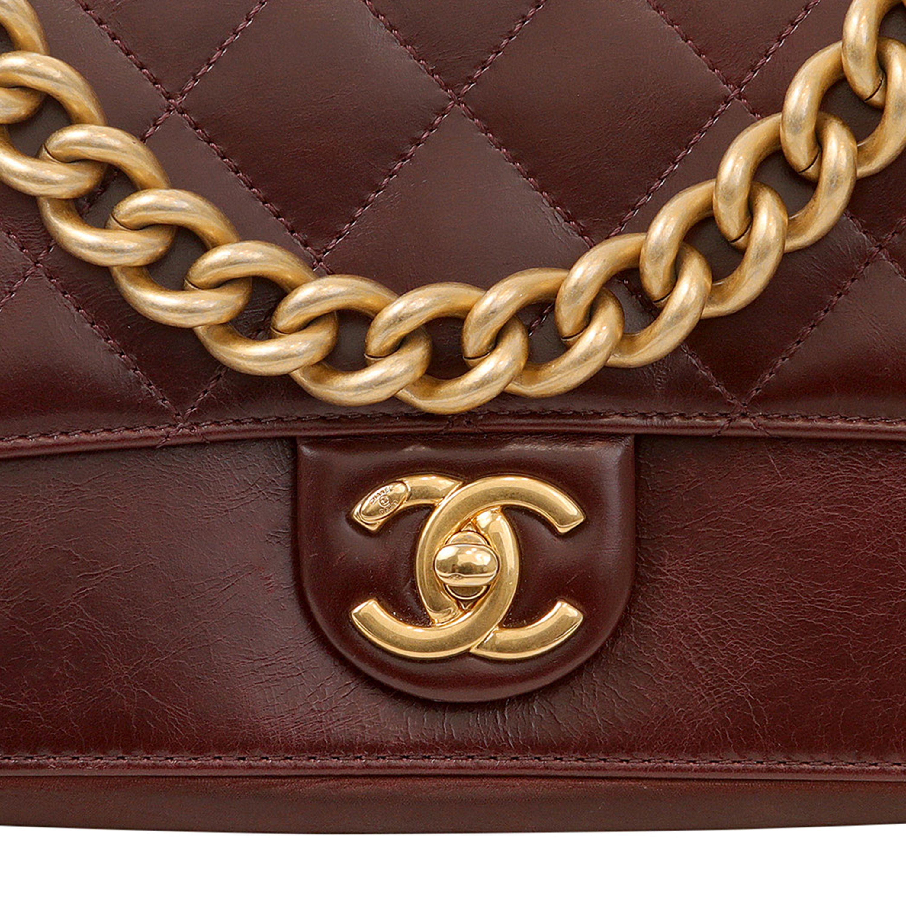 This authentic Chanel Burgundy Lambskin and Suede Accordion Flap bag is in excellent condition. 2016 collection.  Rich burgundy lambskin with suede bottom and interior.  Quilted top flap with matte gold hardware interlocking CC clasp.   Chunky chain
