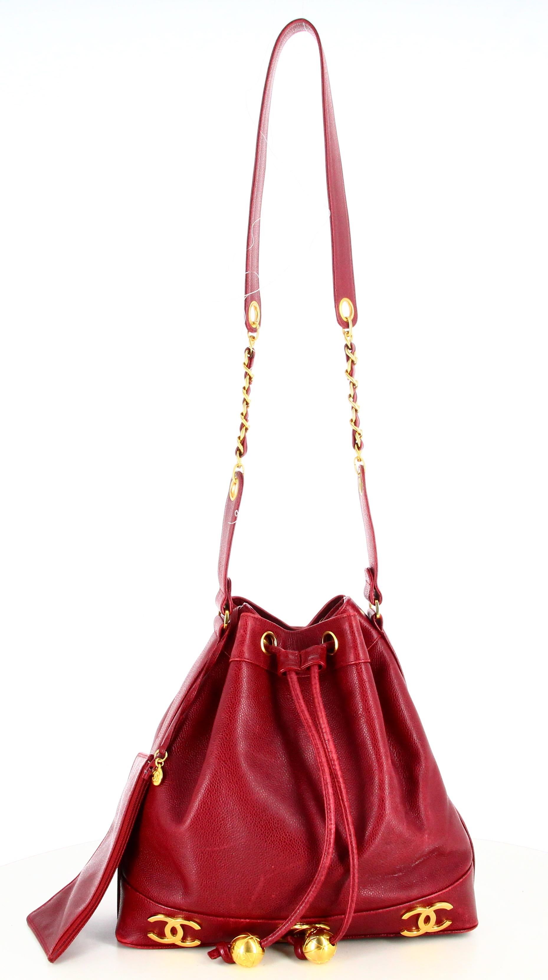 Chanel Burgundy Lambskin Bucket Bag

- Good condition. Shows signs of wear over time. 
- Chanel Bucket Bag 
- Burgundy lamb leather
- Leather lace 
- Chanel golden double C logo 
- Leather shoulder strap and golden chain 
- Interior: Burgundy