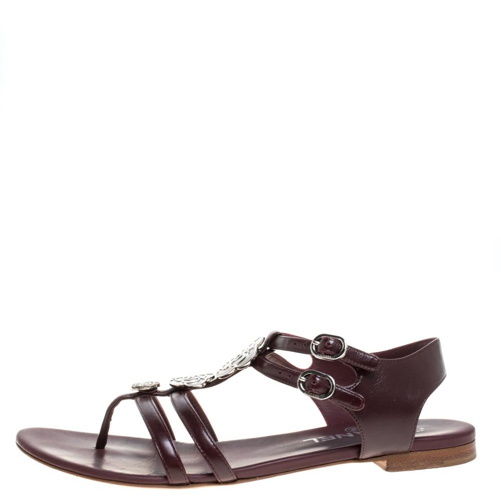 These designer sandals from the house of Chanel are ideal for those days when you have to spend long hours outdoors. They feature signature camellia details and buckle closure. They are made from burgundy leather and are a perfect blend of fashion