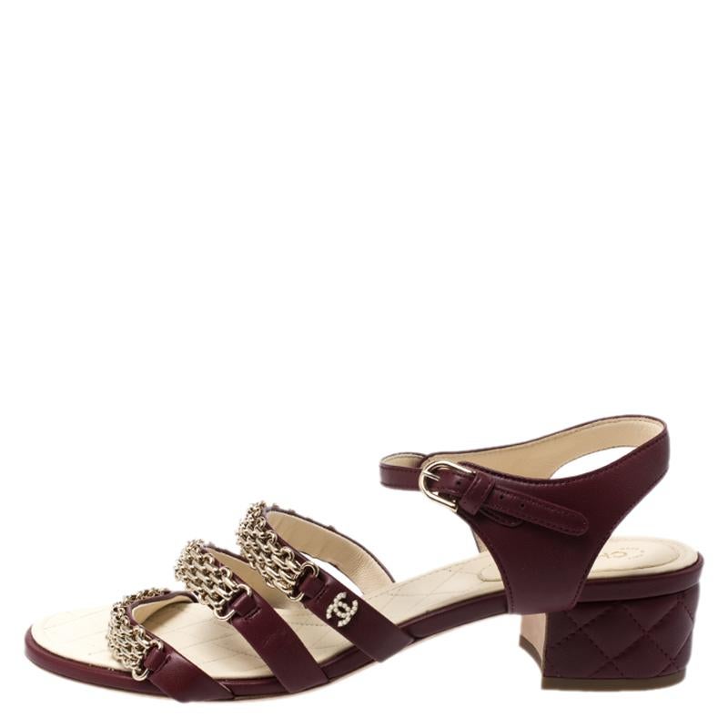 These classic sandals by Chanel are a closet staple for any woman. Mixing the classic Chanel elements with a fun and modern look, these sandals are a perfect bet for those day time occasions and parties. Constructed in burgundy leather, these