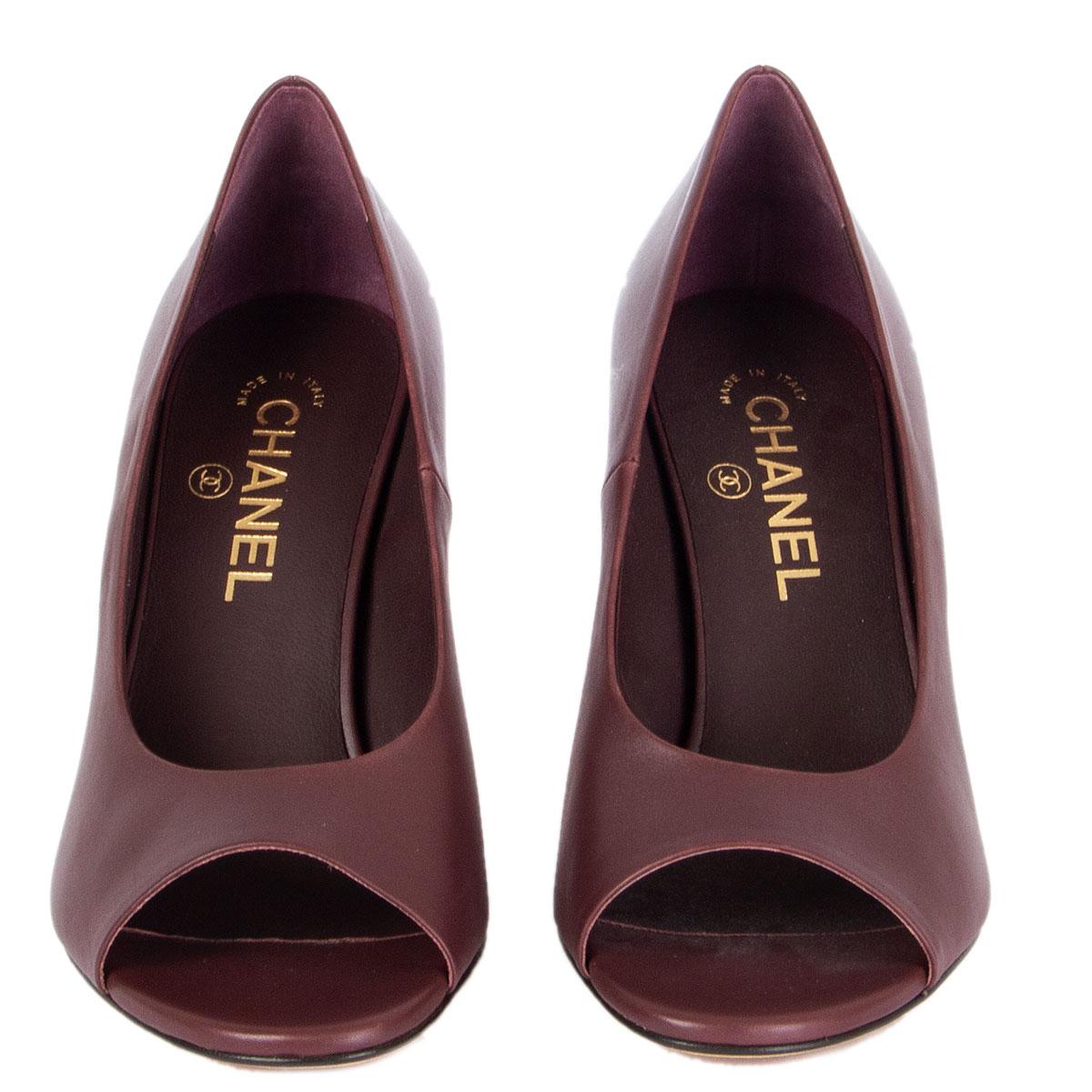 100% authentic Chanel open-toe pumps in burgundy smooth leather featuring gold-tone round chain-heel. Brand new. Come with dust bag. 

Imprinted Size	38.5
Shoe Size	38.5
Inside Sole	24.5cm (9.6in)
Width	7.5cm (2.9in)
Heel	8.5cm