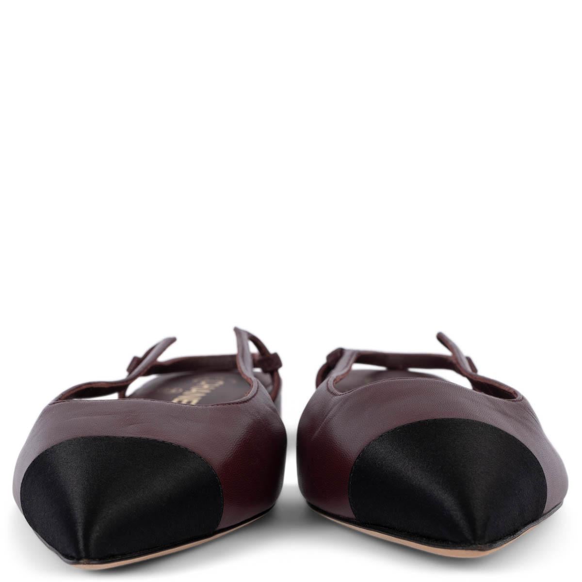 100% authentic Chanel slingback flats in burgundy leather with classic black satin cap toe. CC logo in gold-tone metal on the heel. Brand new. 

Measurements
Model	G35261
Imprinted Size	39 fit 38.5
Shoe Size	38.5
Inside Sole	26cm
