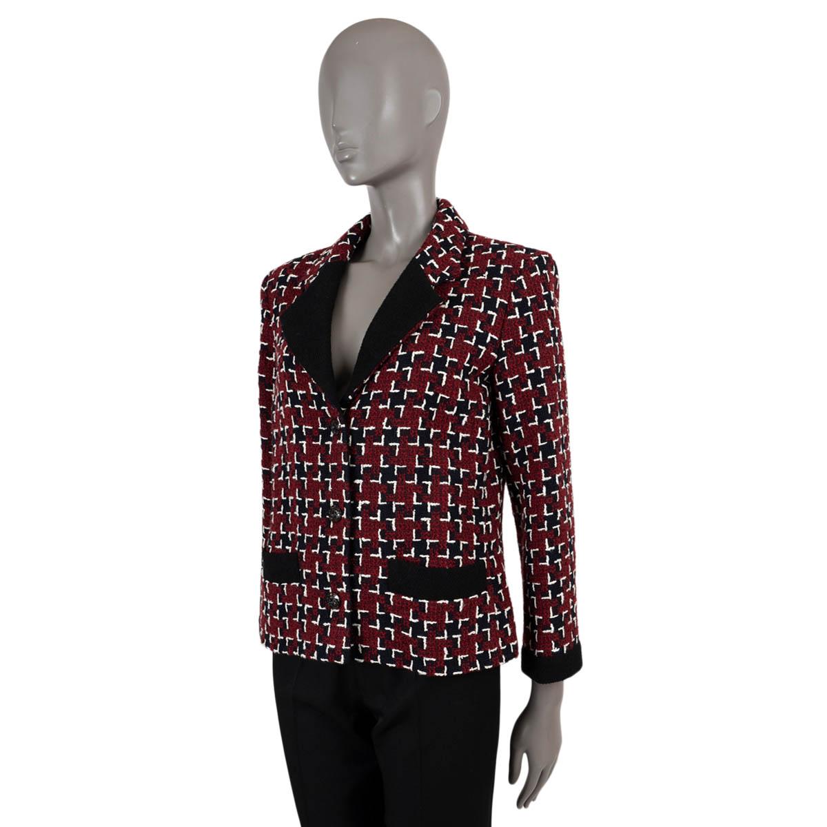 100% authentic Chanel houndstooth tweed jacket in burgundy, black and white wool (87%), cotton (7%) and nylon (6%). Features black peak lapel, trims and cuffs and two open pockets at the waist. Close with clear buttons on the front and is lined in