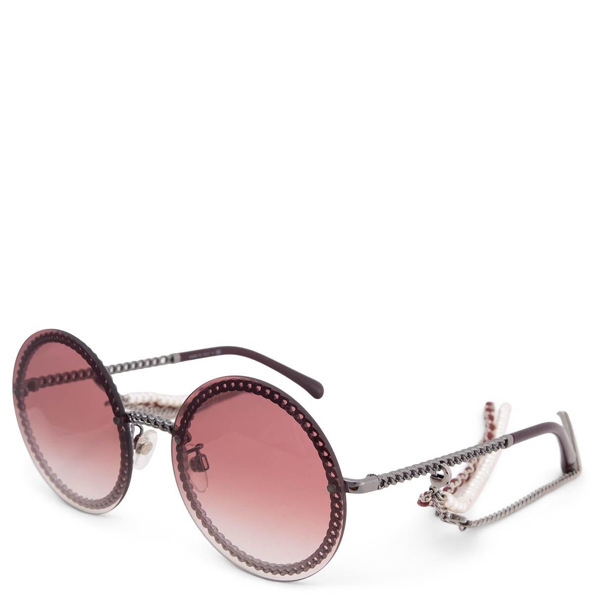 100% authentic Chanel round chain frame sunglasses in dark silver with removable triple hanging chain in faux perals and burgundy calfskin. The sunglasses feature burgundy gradient lenses. Have been worn and are in excellent condition. Hanging Chain