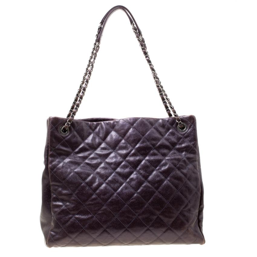 You will love carrying this fabulous tote from Chanel for your special outings. The burgundy tote is crafted from leather and features the everlasting quilted pattern on the exterior. It flaunts dual chain and leather interwoven handles and the