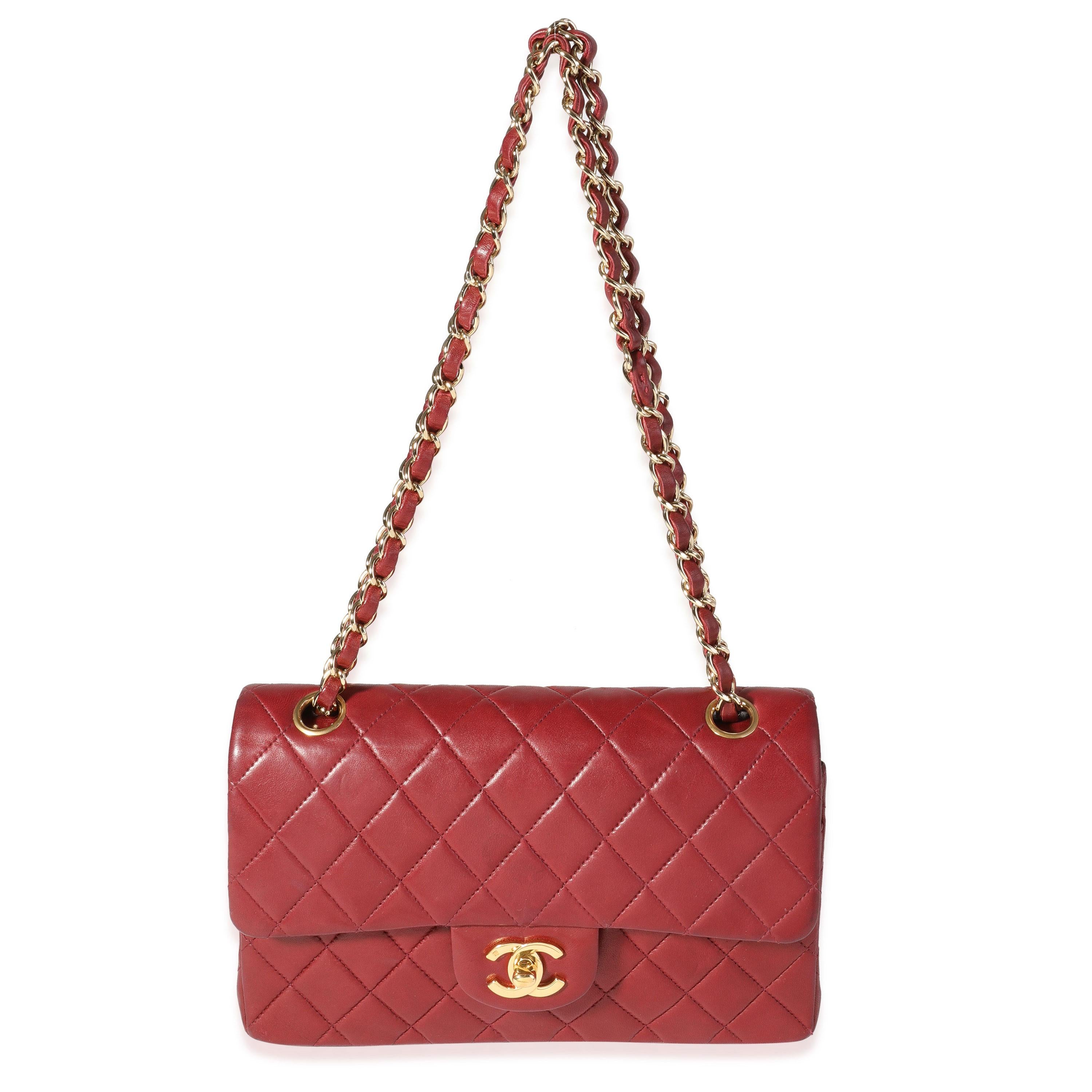 Listing Title: Chanel Burgundy Quilted Lambskin Small Classic Double Flap Bag
SKU: 120585
MSRP: 8200.00
Condition: Pre-owned 
Handbag Condition: Good
Condition Comments: Good Condition. Scuffing to corners, and throughout exterior. Discoloration to