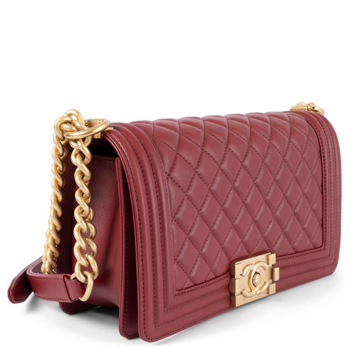 100% authentic Chanel Medium Boy shoulder bag in burgundy quilted lambskin featuring mat gold-tone hardware. Lined in burgundy grosgrain with an open pocket against the back. Excellent condition. Comes with dust bag, box and authenticity card.