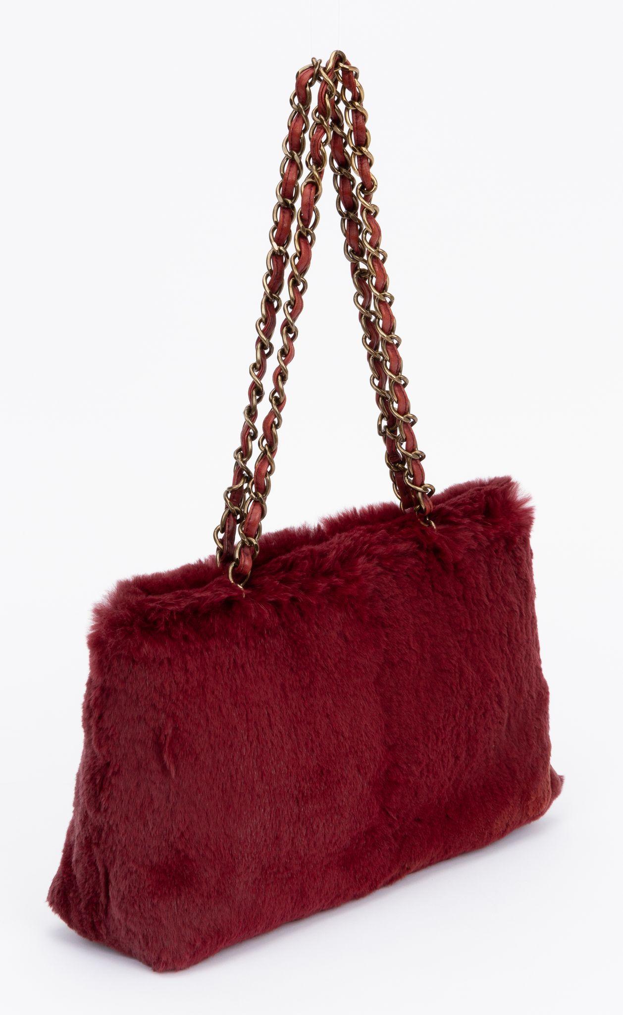 Chanel burgundy rabbit fur shoulder tote with chain straps. Shoulder drop 10