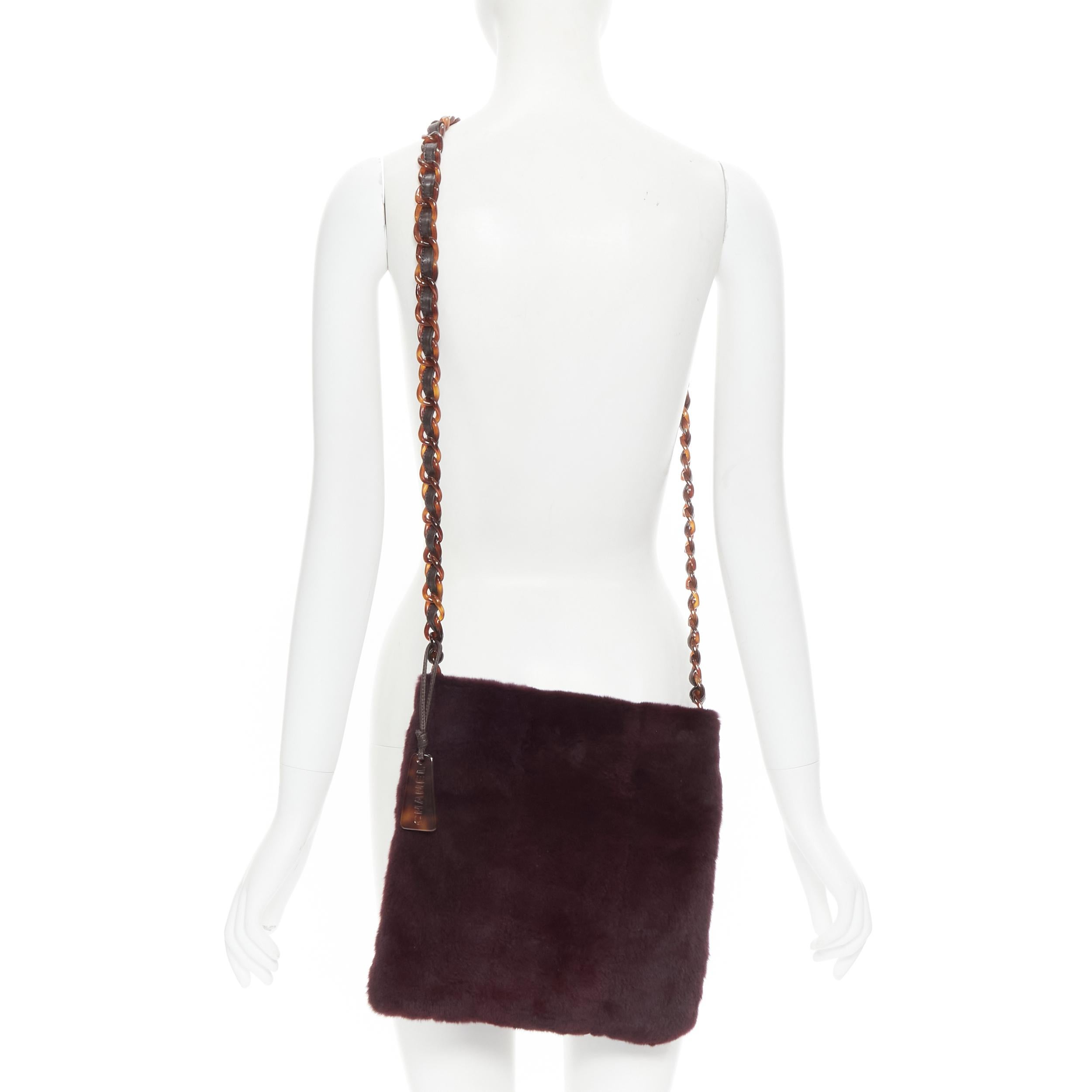 CHANEL burgundy red rabbit fur tortoise resin chain link crossbody bag 
Reference: GIYG/A00089 
Brand: Chanel 
Model: Fur crossbody 
Material: Fur 
Color: Burgundy 
Pattern: Solid 
Closure: Zip 
Extra Detail: Genuine rabbit fur. Tortoise brown resin