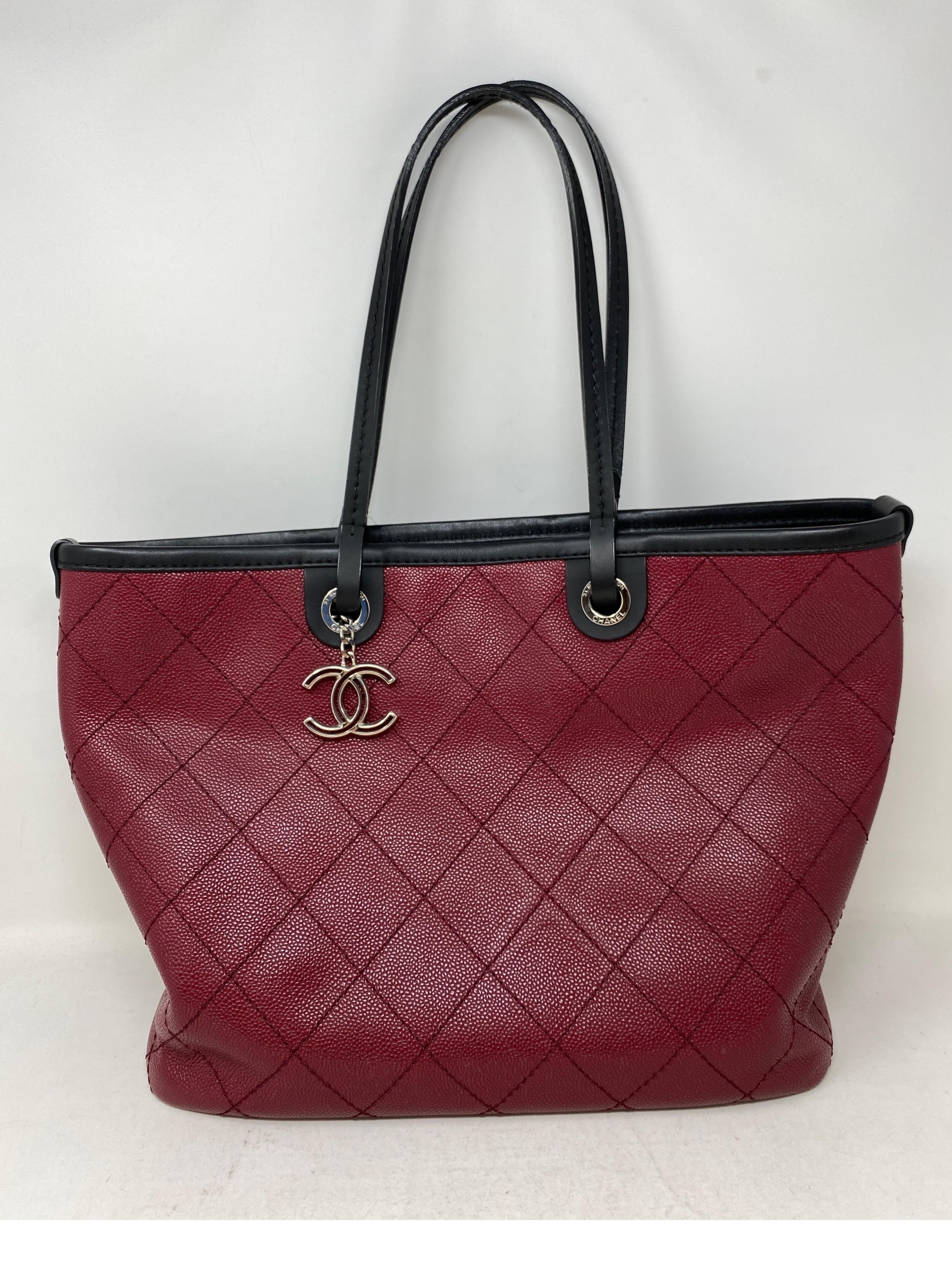 Chanel Burgundy Tote Bag. Caviar leather. Excellent condition. Tote bag includes leather pouch inside. Great tote bag for everyday and travel. Interior clean. Navy interior. Guaranteed authentic. 