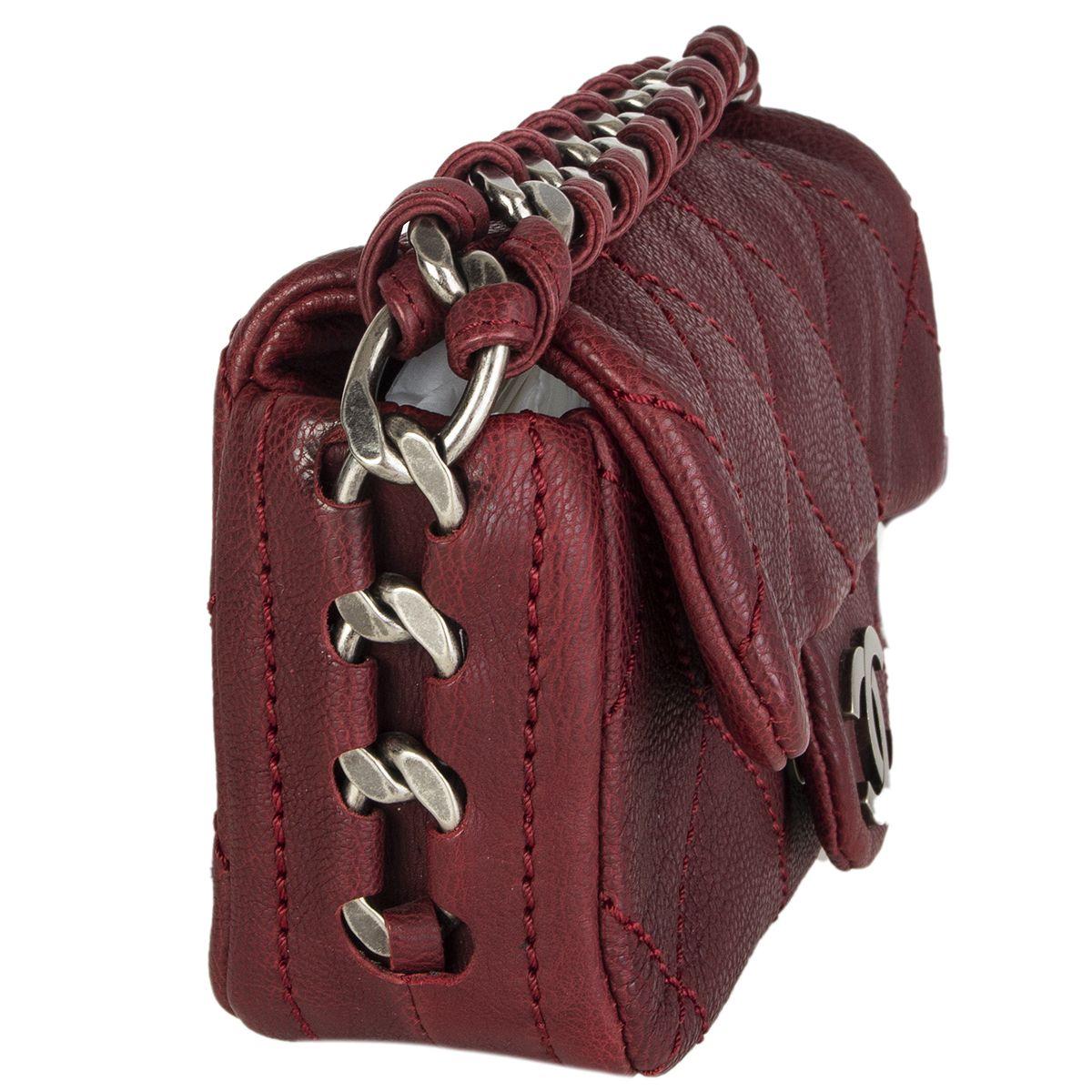 Chanel 'Modern Chain' mini flap bag in burgundy washed caviar leather featuring gunmetal CC push button closre and chunky chain shoulder strap. Lined in nude calfskin with one open pocket against the back. Has been carried and is in excellent