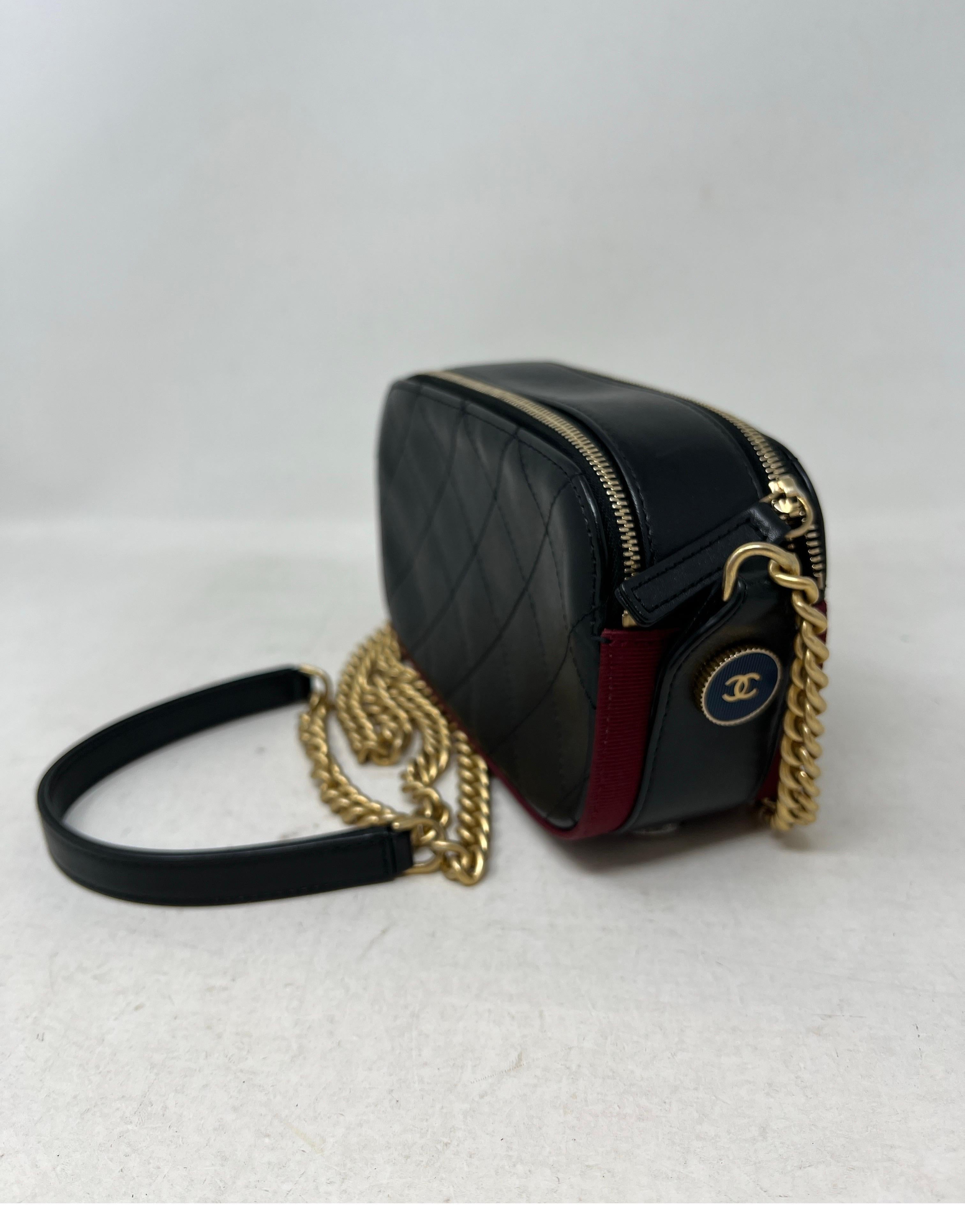 Chanel Button Up Black Leather Double Zip Up Bag. Excellent condition. Gold hardware. Can be worn crossbody. Interior is clean. Unique style with buttons on the bottom of the bag. Priced to sell quickly. Don't miss out. Serial number inside bag.