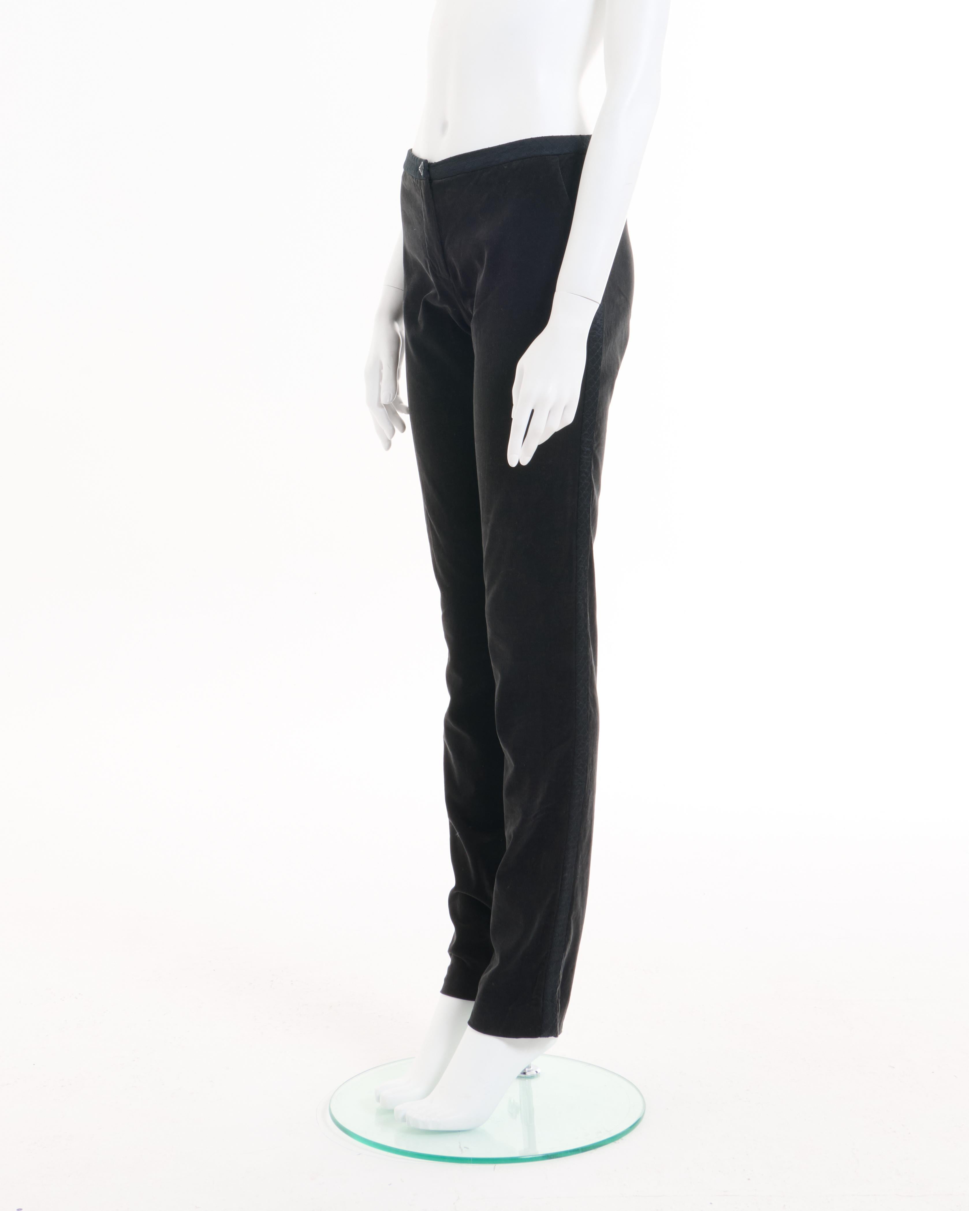 - Designed by Karl Lagerfield
- Sold by Skof.Archive
- Autumn Winter 2004 Collection
- Black Velvet Ribbed Pants
- Knitted details at the waist 
- Button closure 
- Velvet surface
- Straight fit
- Excellent Condition
- Made in Italy
- Composition: