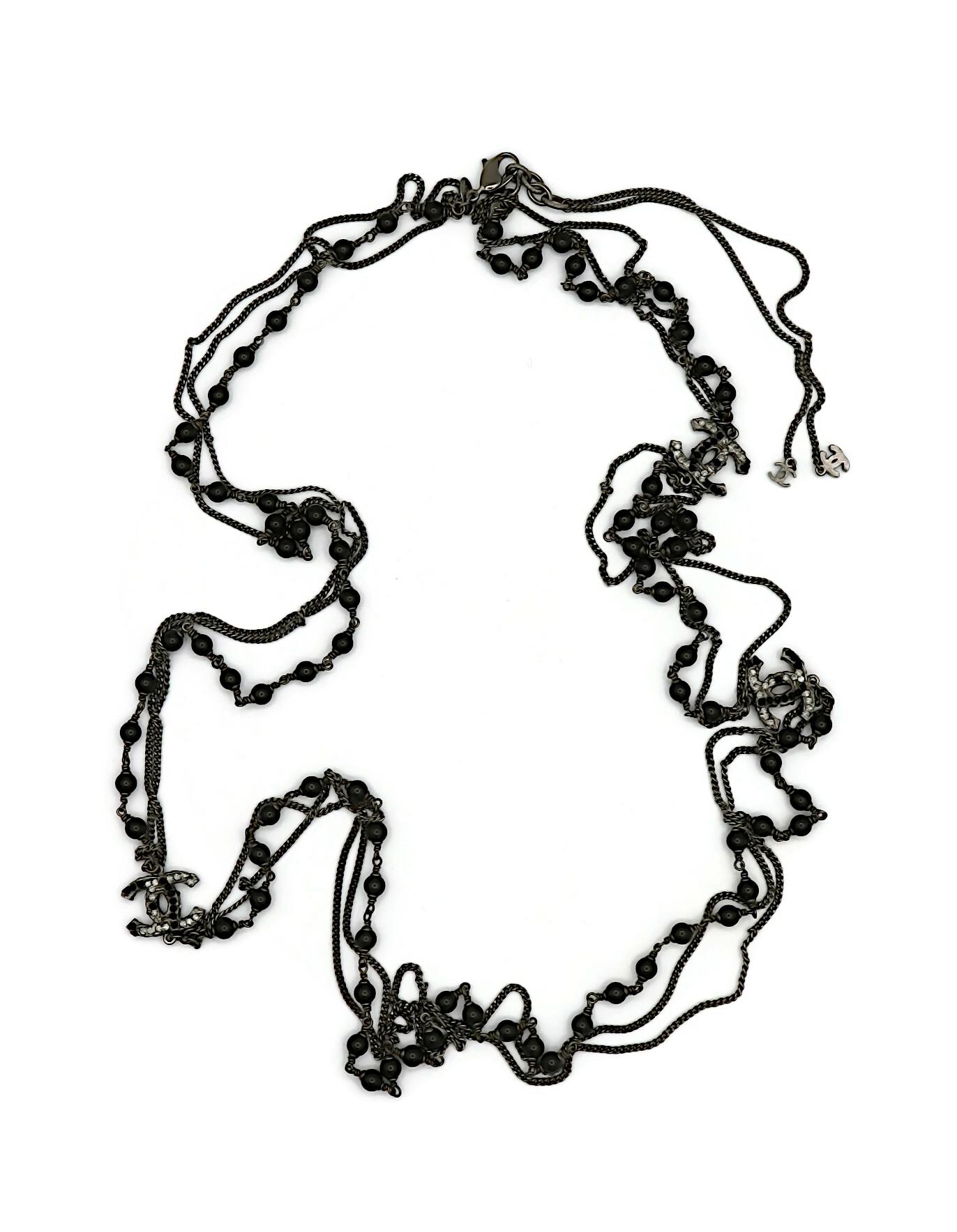 CHANEL by KARL LAGERFELD ruthenium tone necklace featuring chains, black beads and 3 jewelled textured CC logos.

Lobster clasp closure.

Marked CHANEL 10A Made in France.

Indicative measurements : adjustable length from approx. 130 cm (51.18