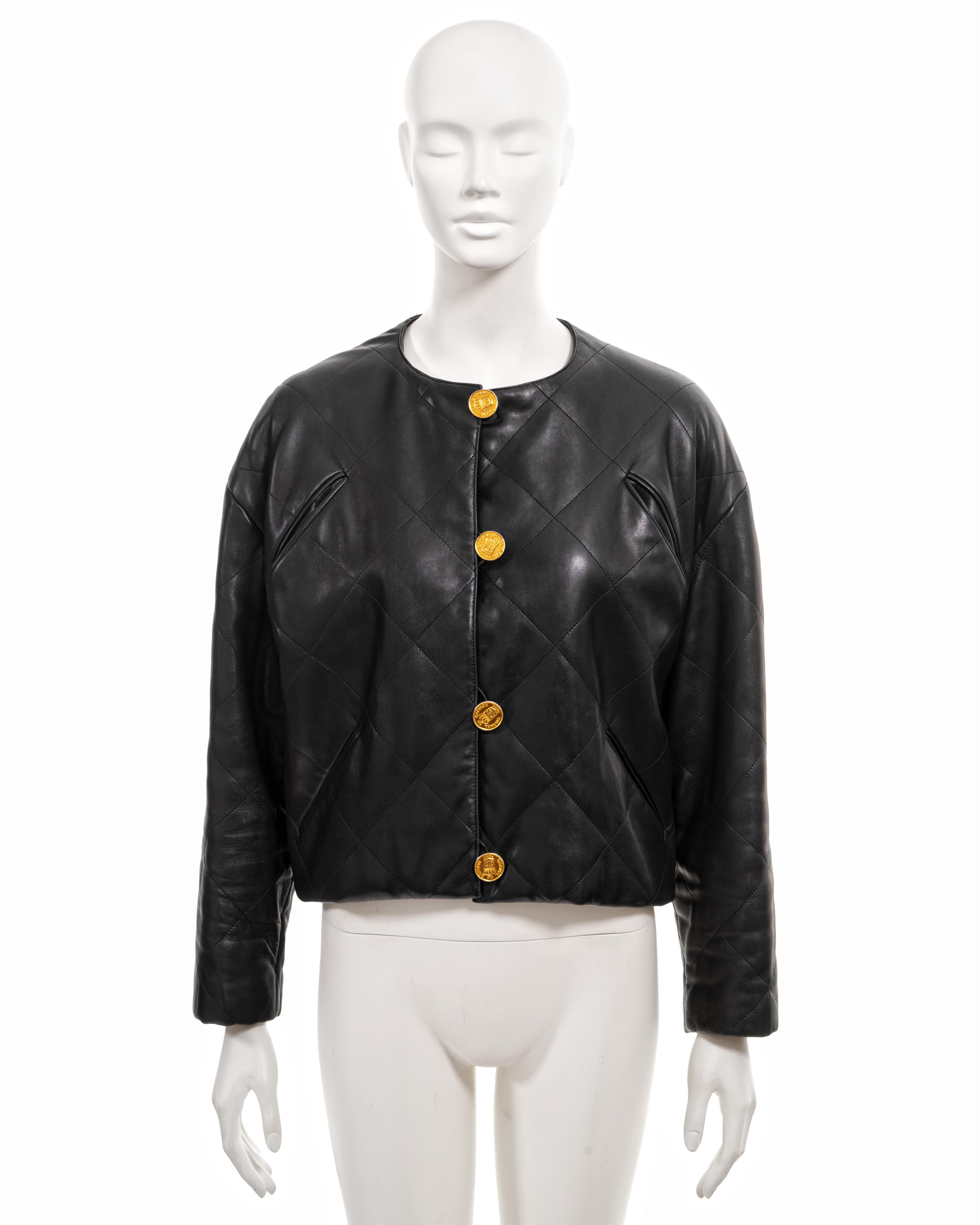 ▪ Chanel vintage leather jacket
▪ Creative Director: Karl Lagerfeld
▪ Fall-Winter 1987
▪ Sold by One of a Kind Archive
▪ Constructed from black quilted lambskin leather 
▪ Dropped shoulder 
▪ Wide cut 
▪ Gold coin-style Chanel buttons 
▪ Silk lining