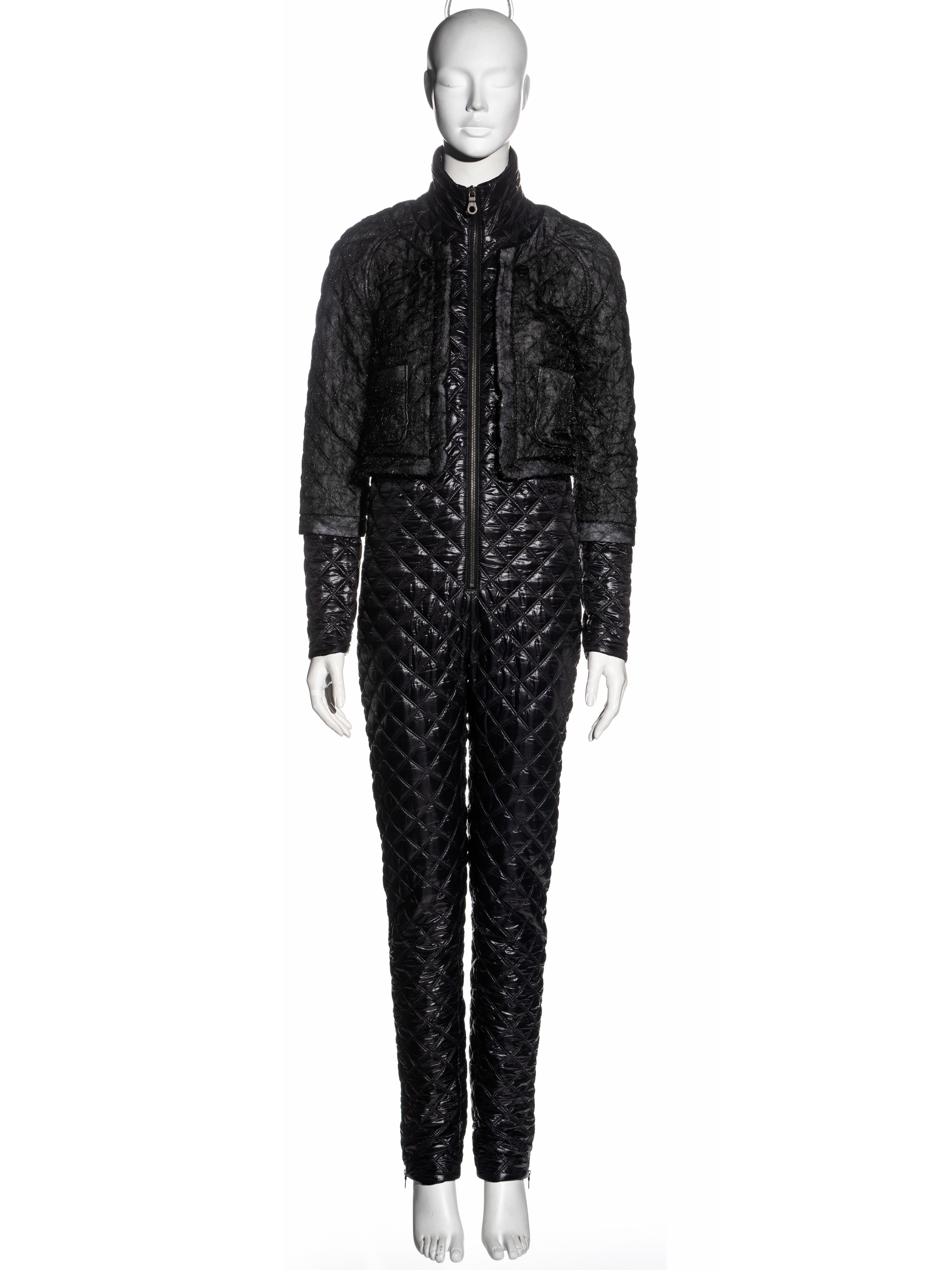 ▪ Chanel jumpsuit 
▪ Designed by Karl Lagerfeld 
▪ Black quilted nylon 
▪ Attached cropped jacket 
▪ Zip fastenings 
▪ FR 36 - UK 8 - US 4
▪ Fall-Winter 2011
▪ 98% Polyamide, 2% Polyurethane 
▪ Made in Italy