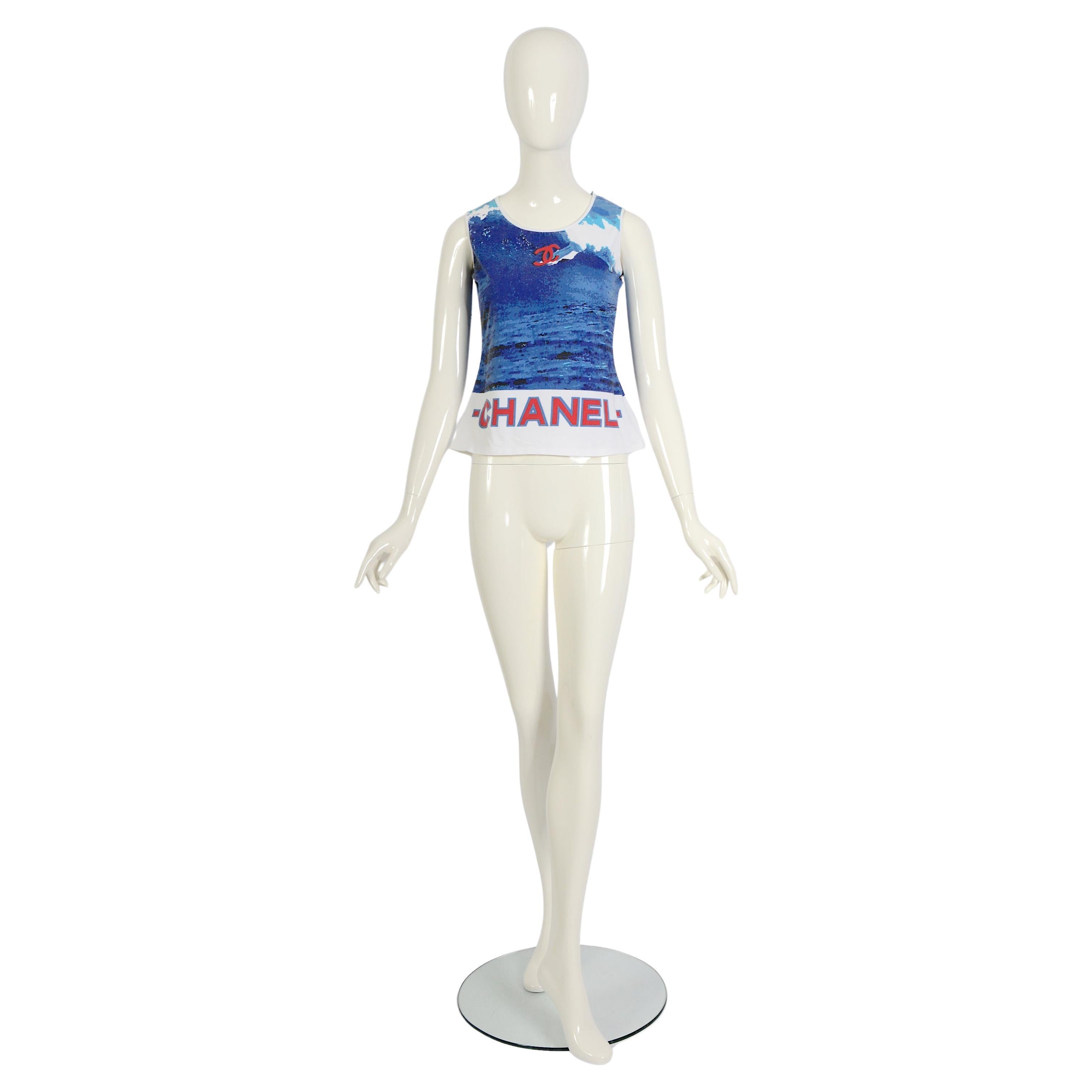 Iconic Chanel printed tank top in cotton from the spring 2002 surf collection designed by Karl Lagerfeld.
The Chanel’s Spring/Summer 2002 collection included many ocean-themed pieces like this Surf top. It features the iconic interlocking CC logo