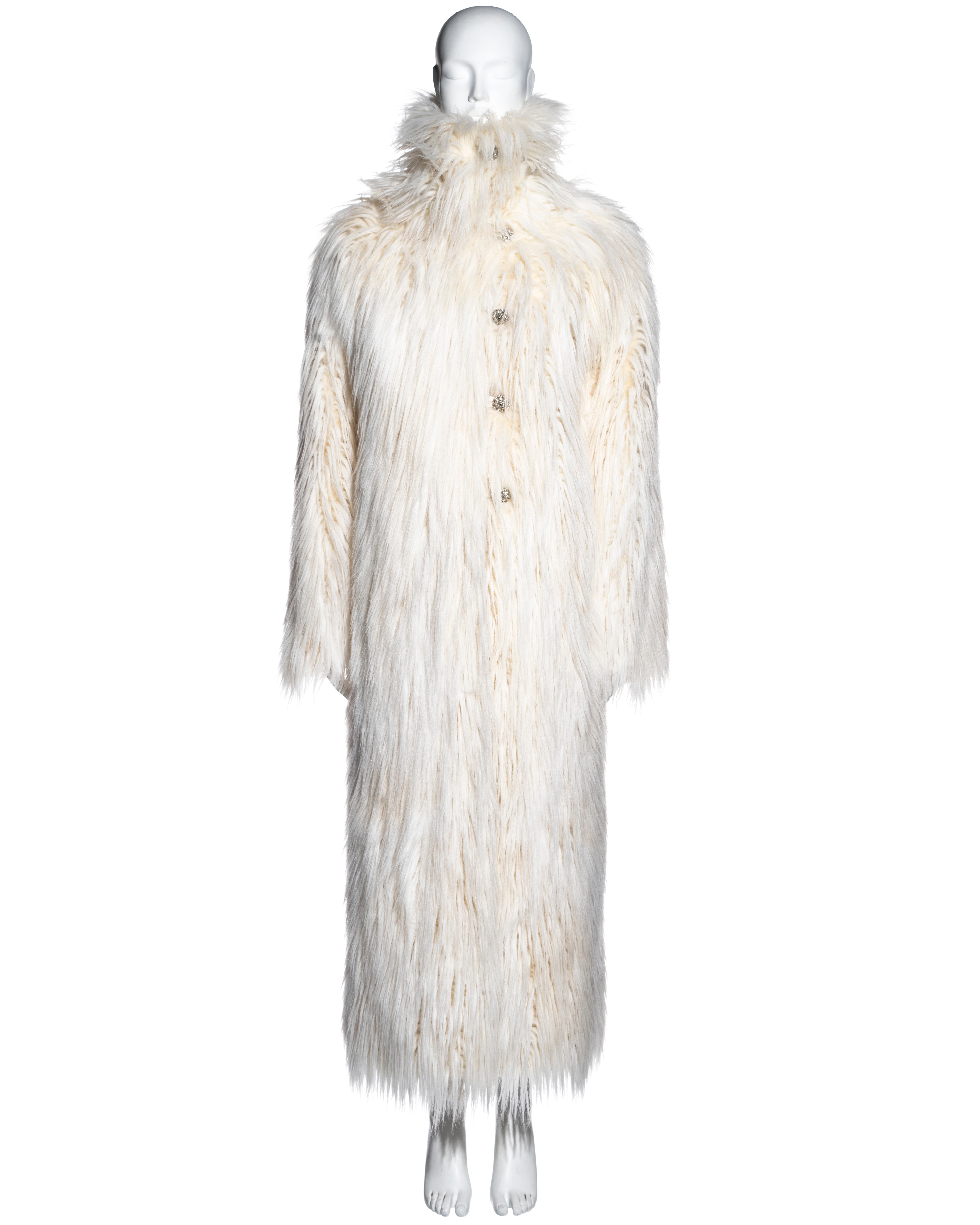▪ Chanel cream full-length fantasy faux fur coat
▪ Designed by Karl Lagerfeld 
▪ Glass stone buttons by Gripoix Paris
▪ High neck
▪ Oversized fit 
▪ 53% Modacrylic, 36% Polyester, 11% Acrylic 
▪ FR 38 - UK 10 - US 6
▪ Fall-Winter 2010