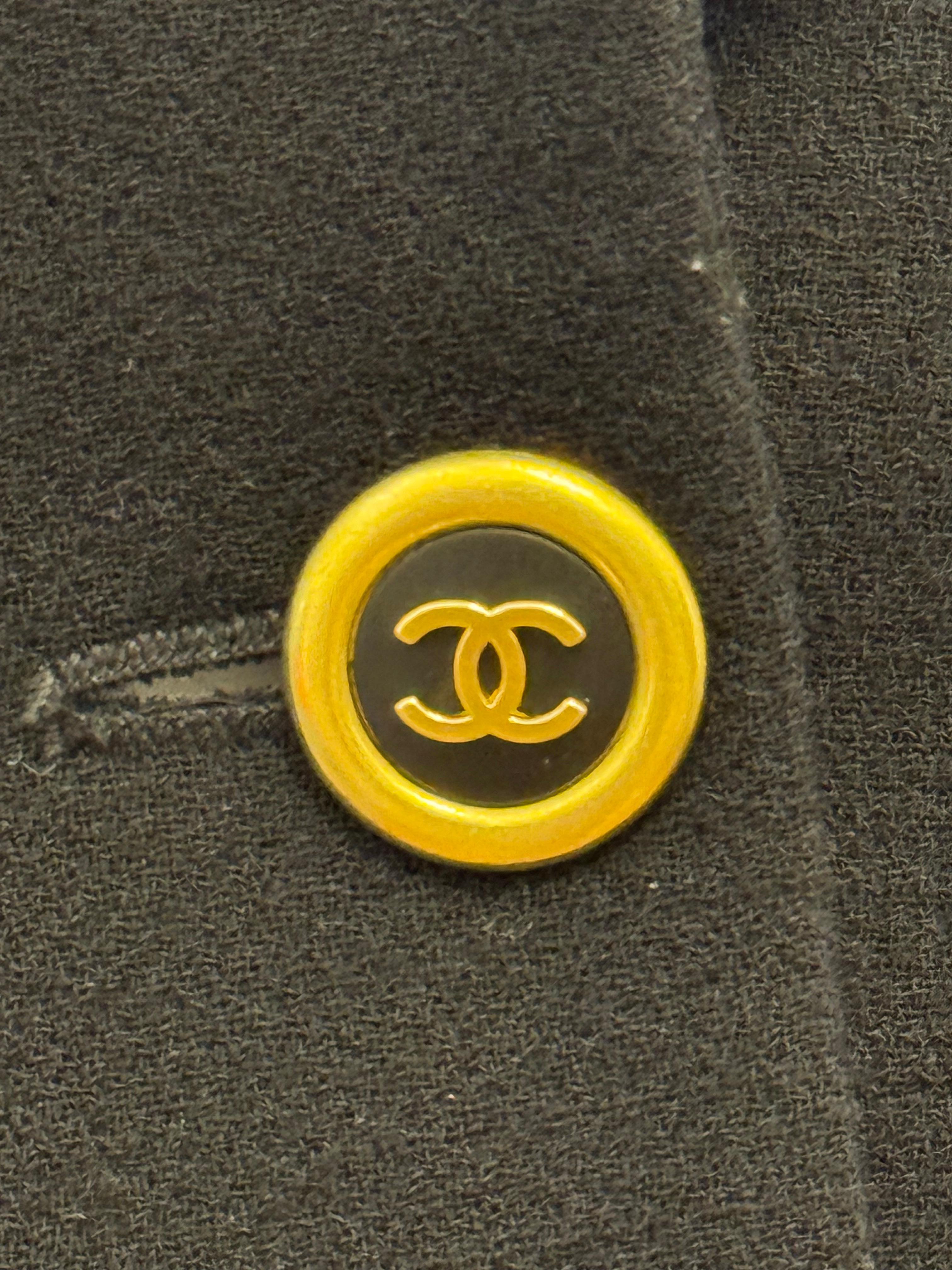 Chanel by Karl Lagerfeld Fall winter 1994 collection, black wool, 24k gold plated cc logo buttons, chain inside, silk logomania lining, no size stag bust : about 18 inches, shoulders about 17 - 17.5 inches (it’s  a little bit stretchy Lycra in the