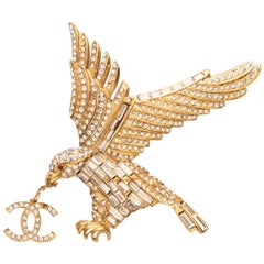 Chanel by Karl Lagerfeld gold and crystal eagle brooch with CC charm, ss 2001