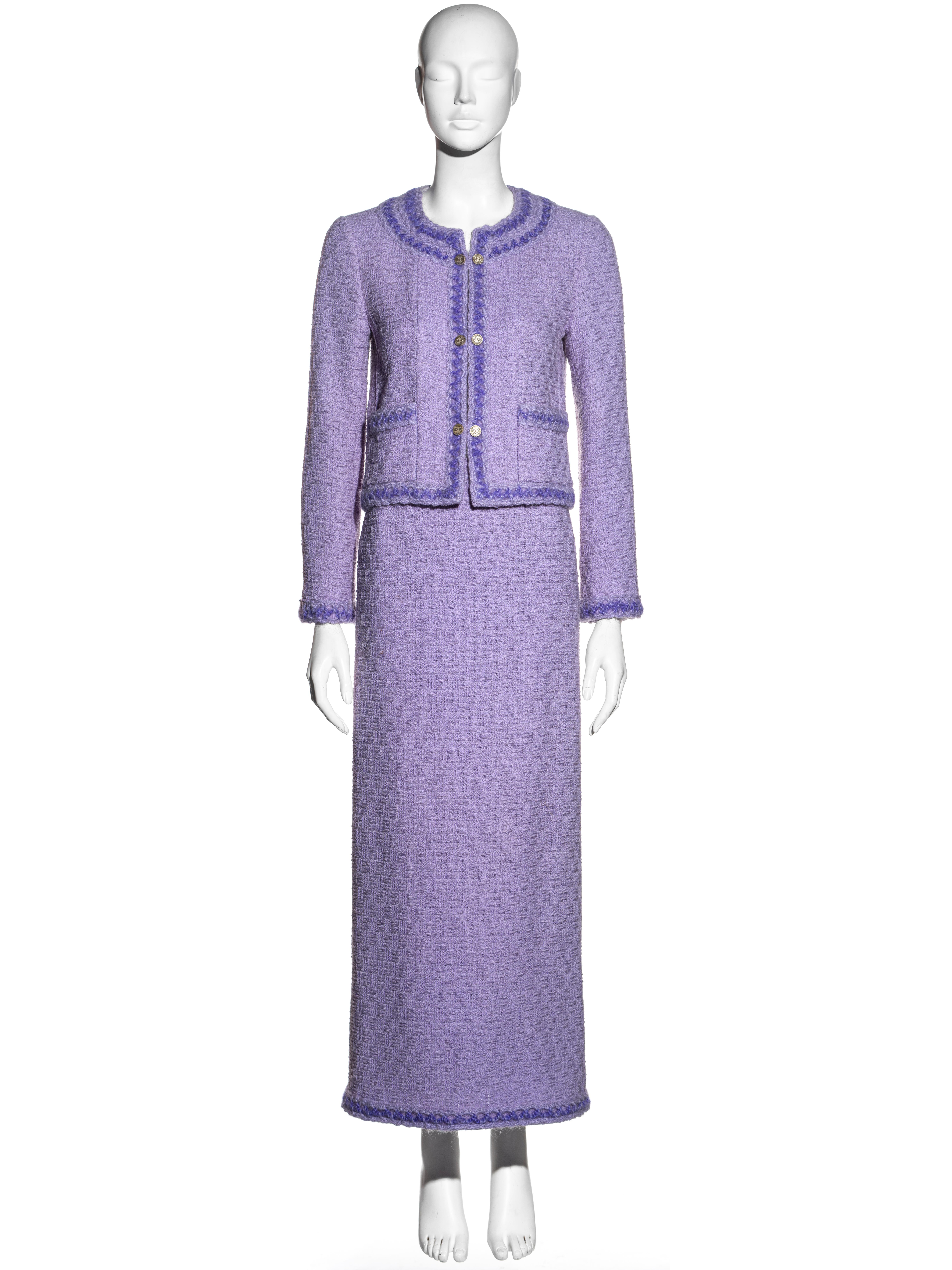 ▪ Chanel lilac tweed skirt suit
▪ Designed by Karl Lagerfeld
▪ Cardigan jacket with dark lilac embroidered lattice trim
▪ 'CC' engraved silver metal cufflink buttons 
▪ Maxi skirt with draped detail to the back 
▪ Silk lining
▪ FR 36 - UK 8
▪