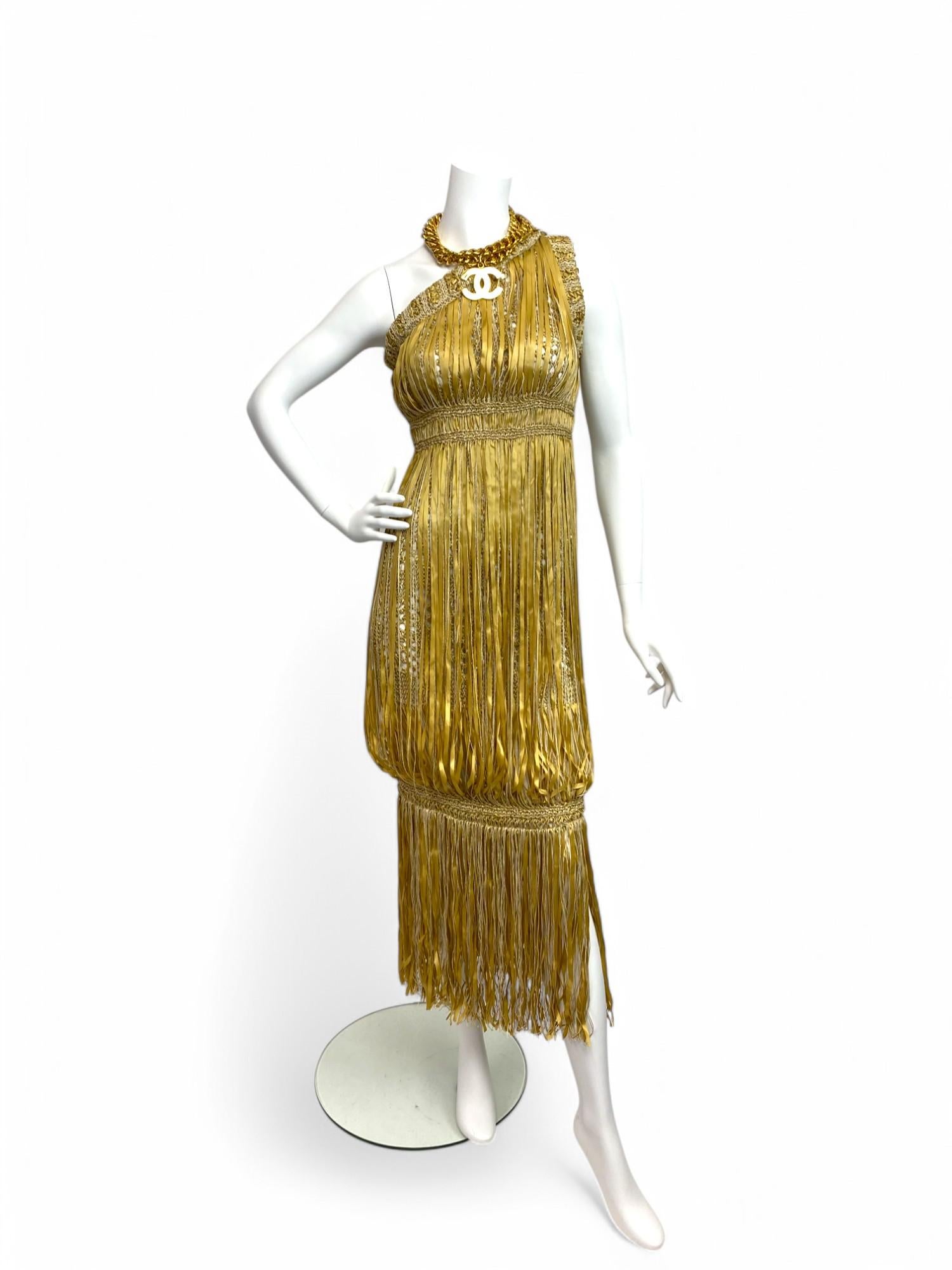 A rare and artfully constructed piece from Chanel’s Spring/Summer 2011 collection, designed under the creative direction of Karl Lagerfeld. This one-shoulder dress is a standout example of the house’s mastery of texture and form, blending natural
