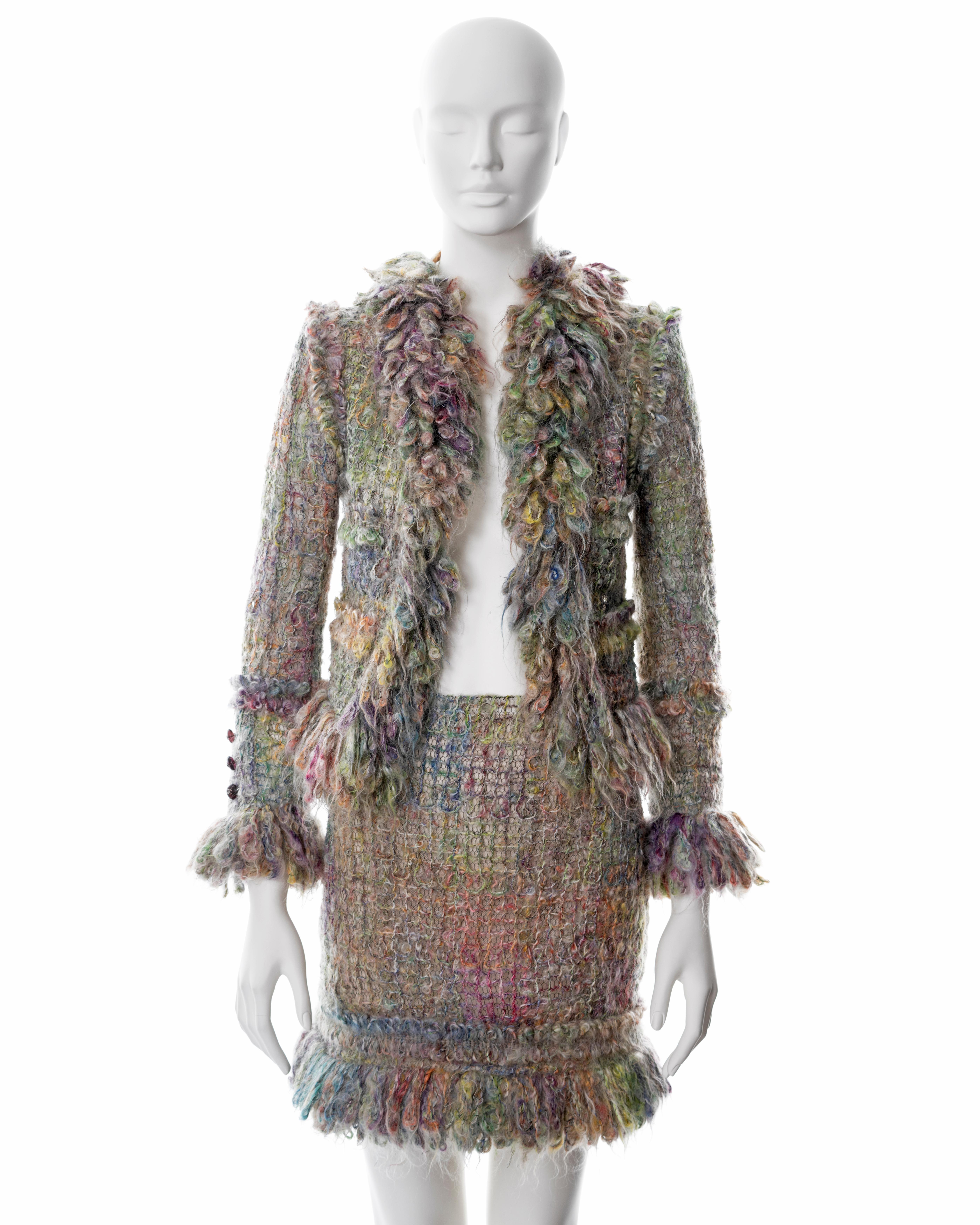 ▪ Chanel multicoloured mohair skirt suit 
▪ Designed by Karl Lagerfeld
▪ Fall-Winter 2003
▪ Constructed from a lattice of mohair and net-lace in pastels of green, pink, orange, blue and yellow 
▪ Lopped fringed trim on the collar, cuffs and skirt