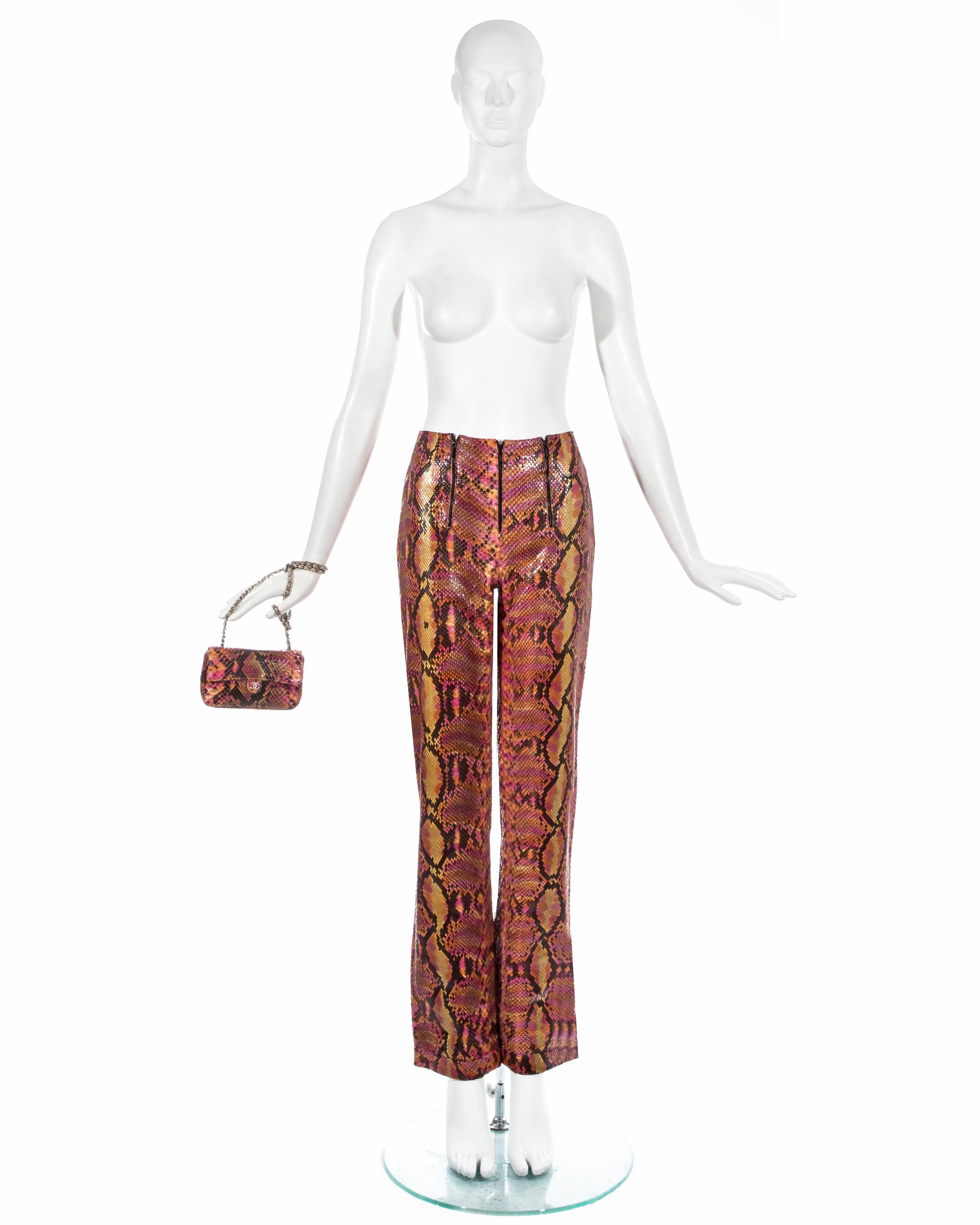 Chanel by Karl Lagerfeld; Pink, orange, and black python snakeskin pants. High waisted, 3 zip fastenings at front, silk lining. Sold with a matching mini flap bag with leather interior, snap button fastening, 'CC' metal logo at front, silver metal