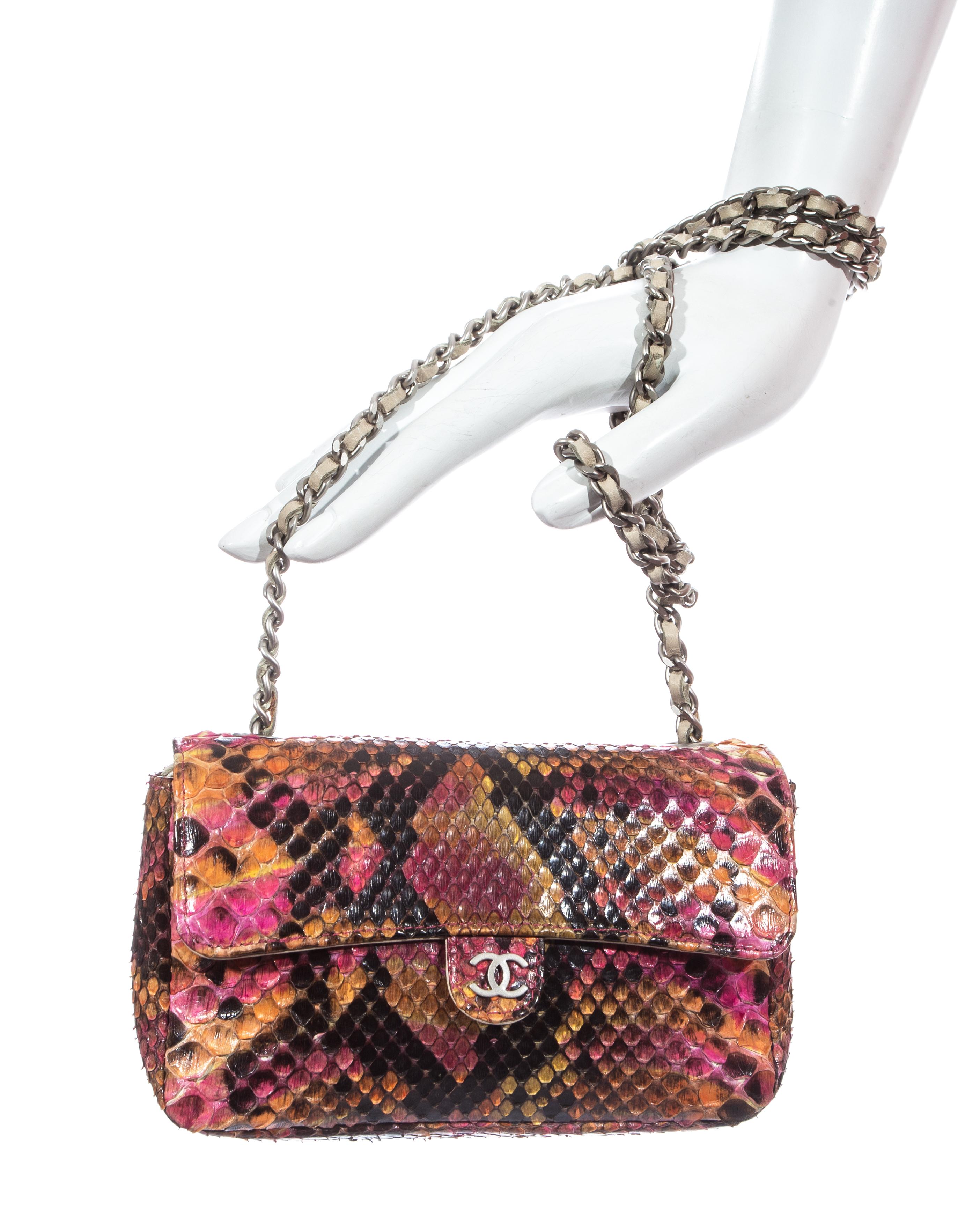 Chanel by Karl Lagerfeld; Pink, orange, and black python snakeskin pants. High waisted, 3 zip fastenings at front, silk lining. Sold with a matching mini flap bag with leather interior, snap button fastening, 'CC' metal logo at front, silver metal