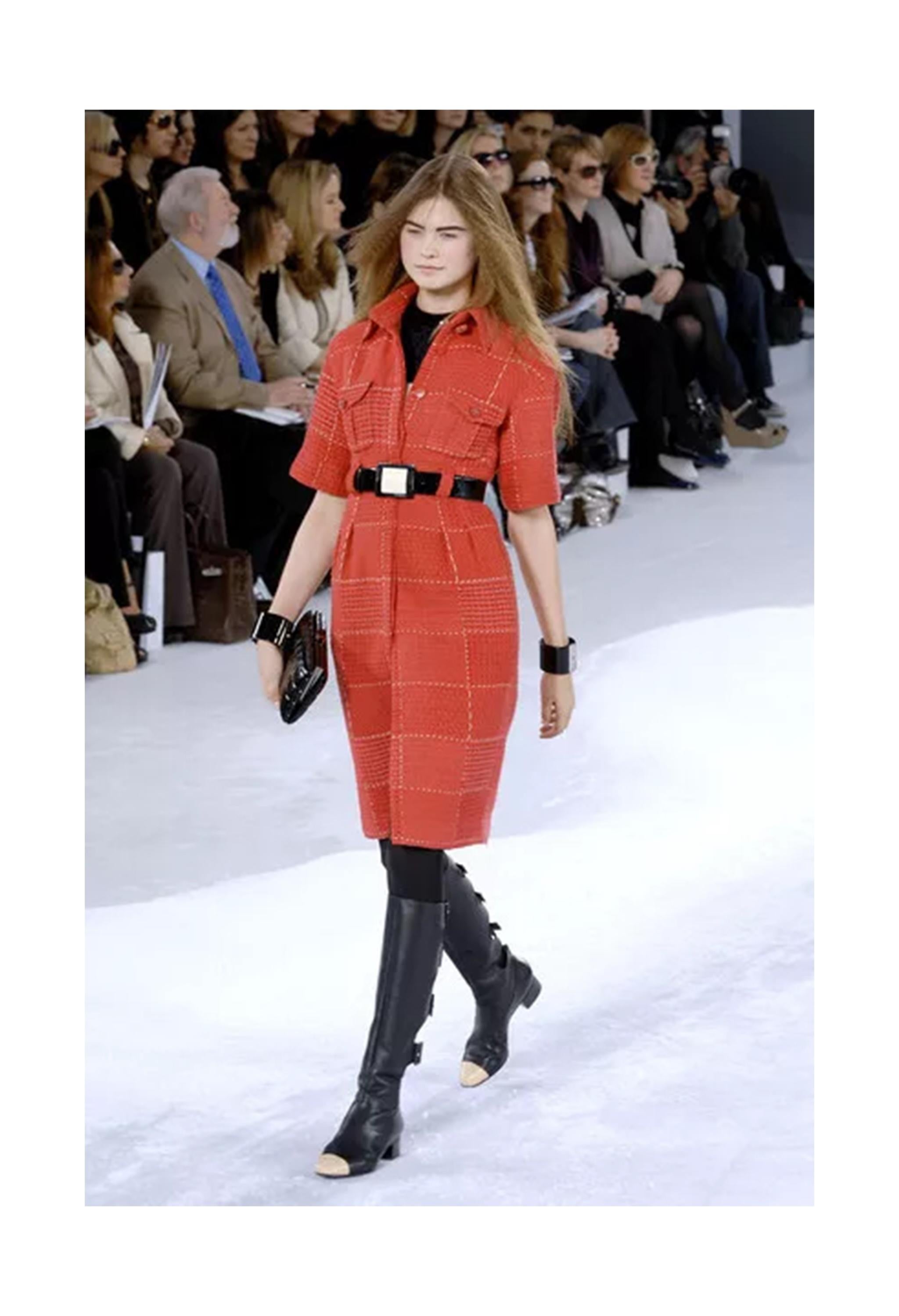 Resurrection Vintage is excited to offer a vintage Chanel by Karl Lagerfeld red and white tweed day dress featuring chest front pockets with flaps, a folding collar, a hidden button placket, elbow-length sleeves, fancy buttons, belt loops, and a