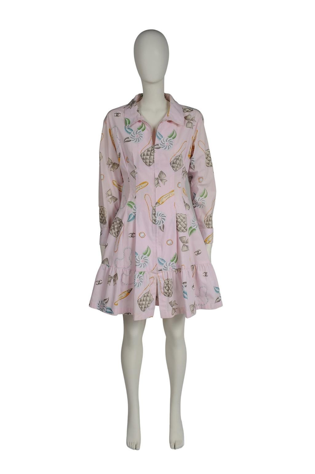 Chanel's SS1996 collection consisted of over 190 looks and most of them became iconic and highly sought after. Made from lightweight, breathable light pink printed cotton-poplin, this shirt-style dress is ideal for the mild spring weather. Cut for a