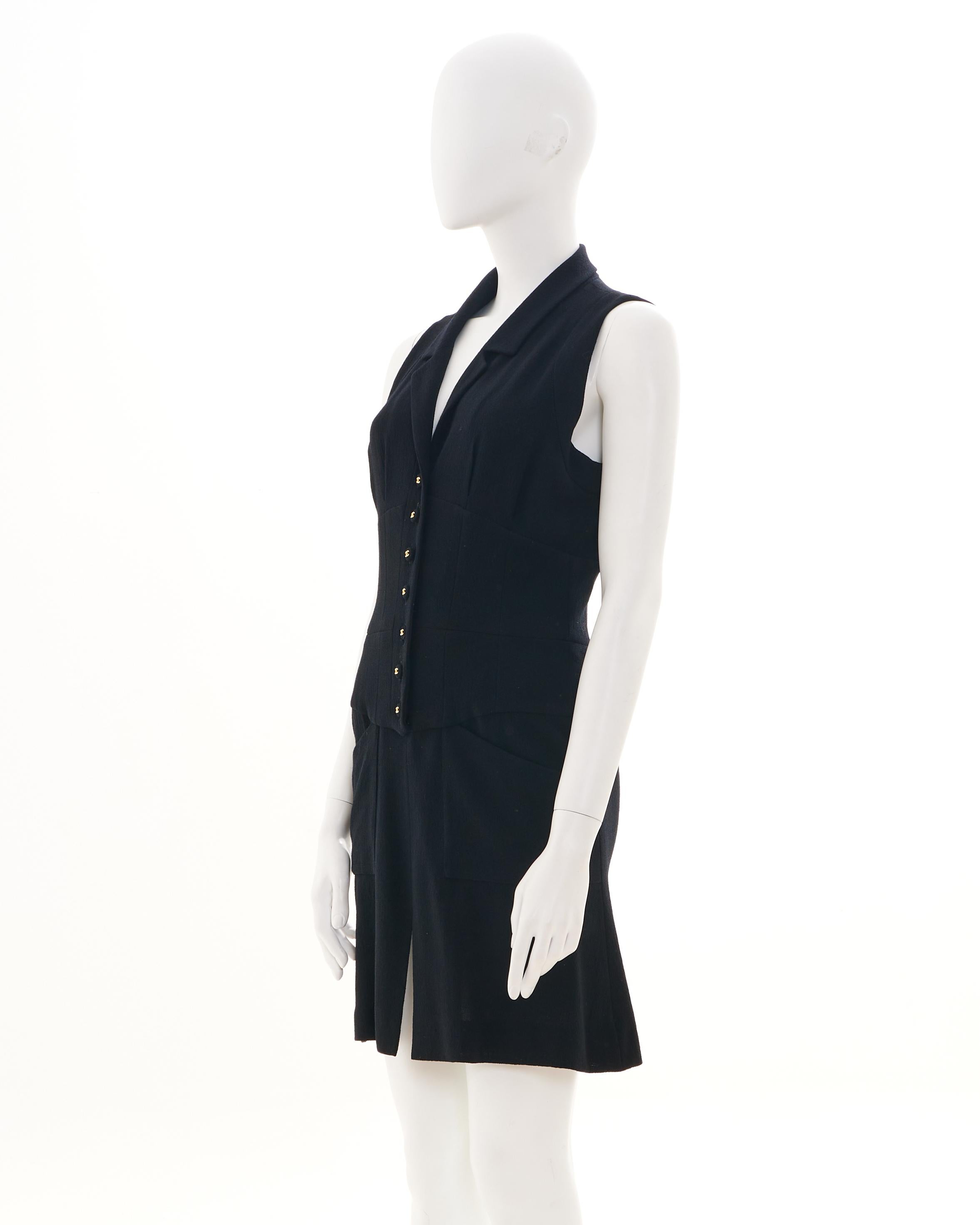 - Sold by SkofArchive
- Designed by Karl Lagerfield
- Spring-Summer 1995 
- Midi Black Sleeveless Dress
- Button up closure
- Black Buttons with Gold 