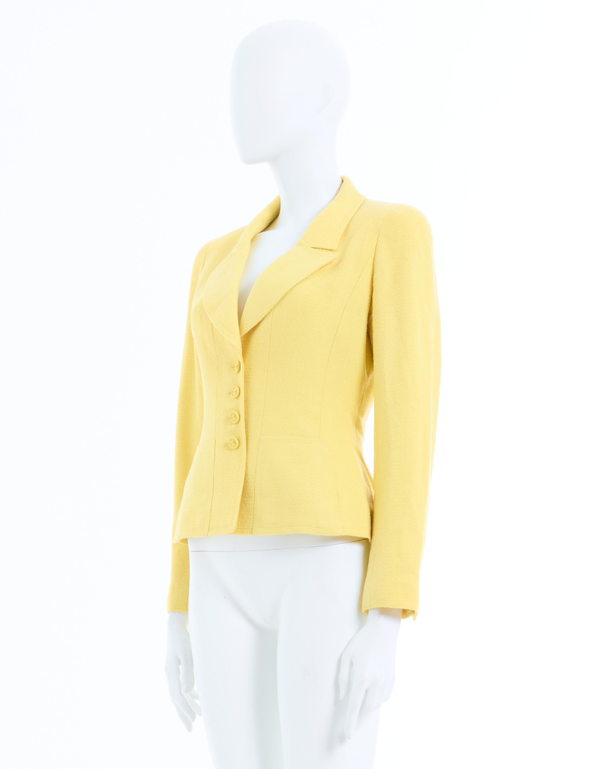 - Chanel Yellow cotton jacket 
- Sold by Skof.Archive 
- Spring-Summer 1997 
- Designed by Karl Lagerfeld 
- Matching yellow Silky lined 
- The jacket has matching tonal CC buttons on the front as well on the cuffs 
- Two front flap pockets 
-
