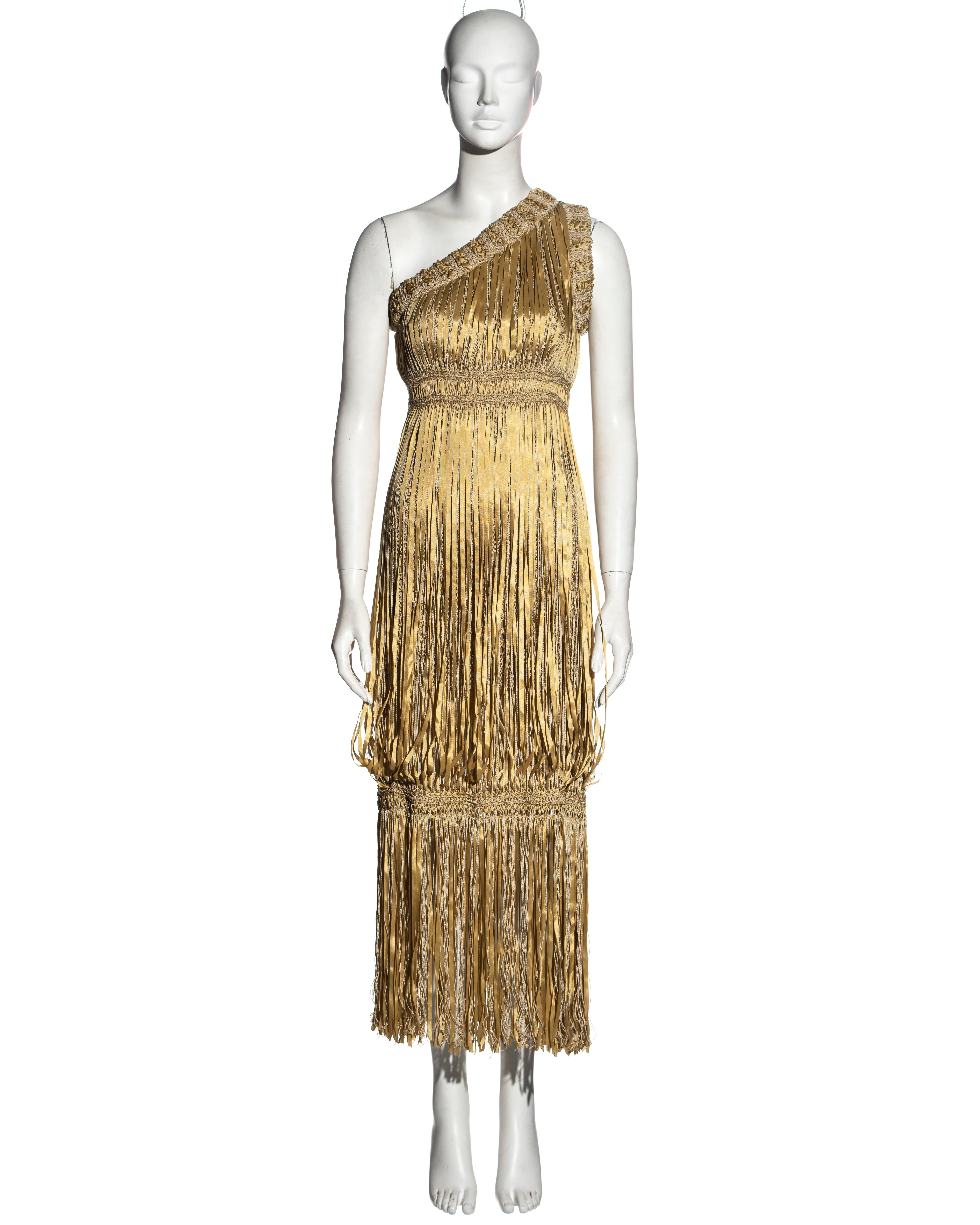 ▪ Chanel straw crochet and ribbon dress
▪ Designed by Karl Lagerfeld 
▪ One-shoulder 
▪ Metallic crochet woven with ribbons 
▪ Ankle-length skirt 
▪ Chiffon lining 
▪ Gold-tone Chanel buttons 
▪ FR 36 - UK 8 - US 4
▪ Spring-Summer / Resort 2011 
▪