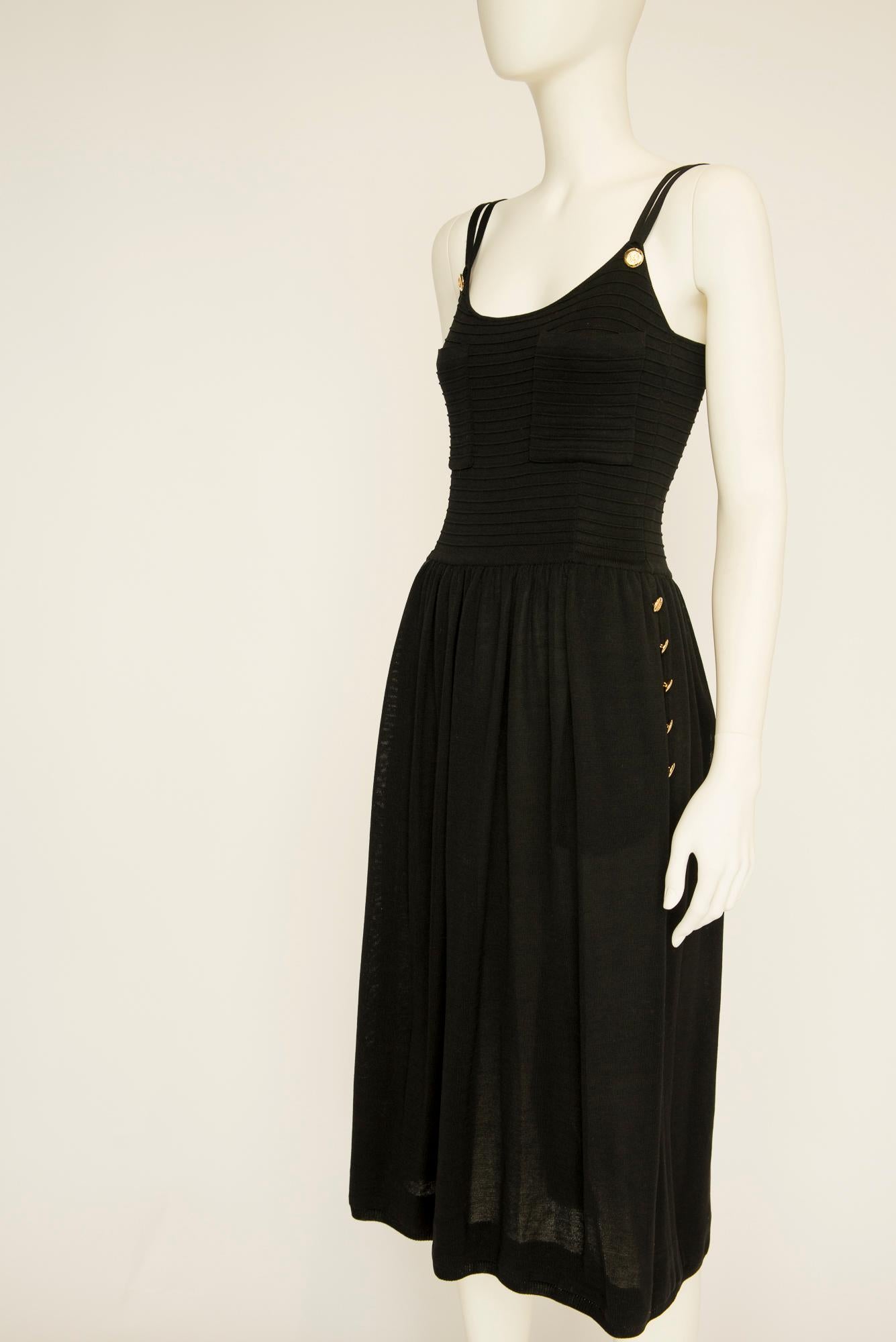 Whether you're summering on the Amalfi Coast or in the Hamptons, this late 80's - early 90’s Chanel by Karl Lagerfeld summer dress and matching cardigan ensure you look effortlessly elegant for day time or evening plans alike.

With its fitted