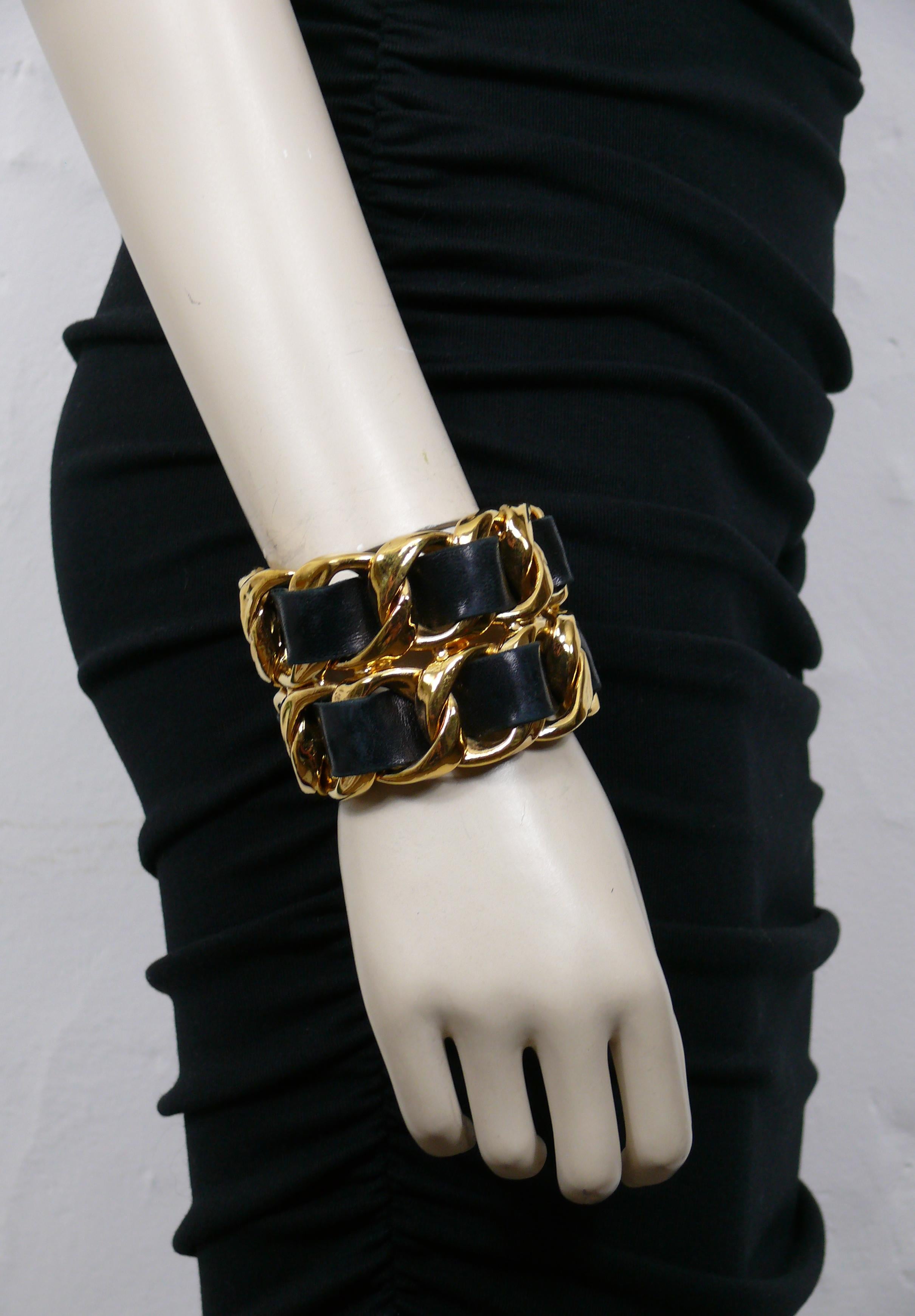 CHANEL by KARL LAGERFELD vintage iconic gold toned rigid chain cuff bracelet featuring woven black leather.

Collection year n°23 (1988).
VICTOIRE DE CASTELLANE era.

Embossed CHANEL 2 3 Made in France.

Indicative measurements : inner circumference